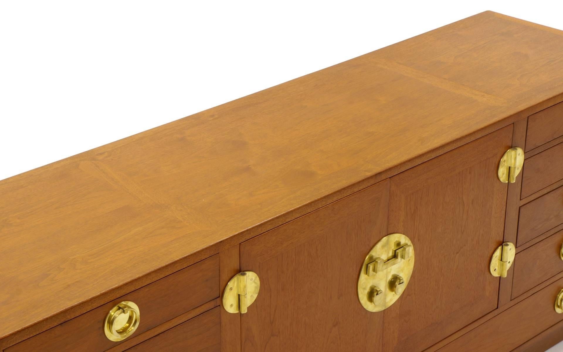 Designed as a dining room buffet / sideboard, this Edward Wormley for Dunbar storage cabinet can be used in any part of the house. The things that make it specific to being a dining room buffet / sideboard are the pull out serving tray and the wide