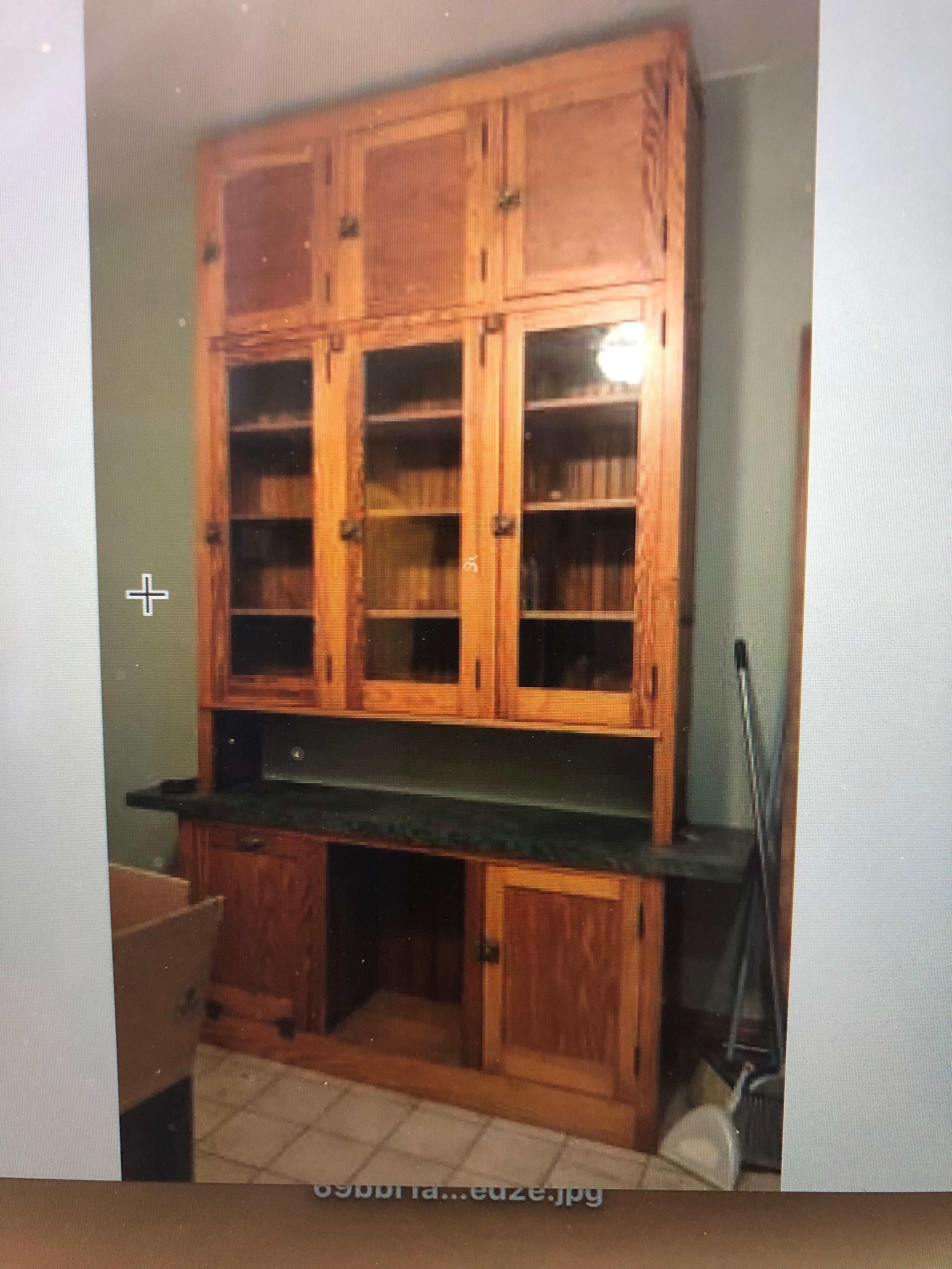 Storage cabinet of pine and glass cabinet with brass hardware from historic Chicago Pullman District home. Linoleum counter, circa 1920s. Two-piece unit, final height is a dramatic 106 inches. Large pull-out galvanized drawer for sugar, flour, etc.