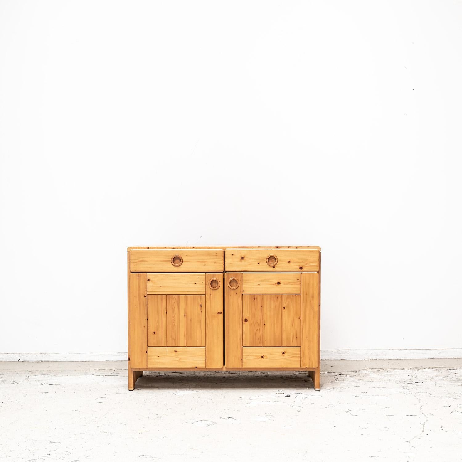 This cabinet was used in Les Arcs 1600. Material is pine wood. 

Charlotte Perriand oversaw the design team at Les Arcs beginning in the late 1960s and with the progressive group, designed and built Arc 1600, Arc 1800 and Arc 2000 at the resort. The