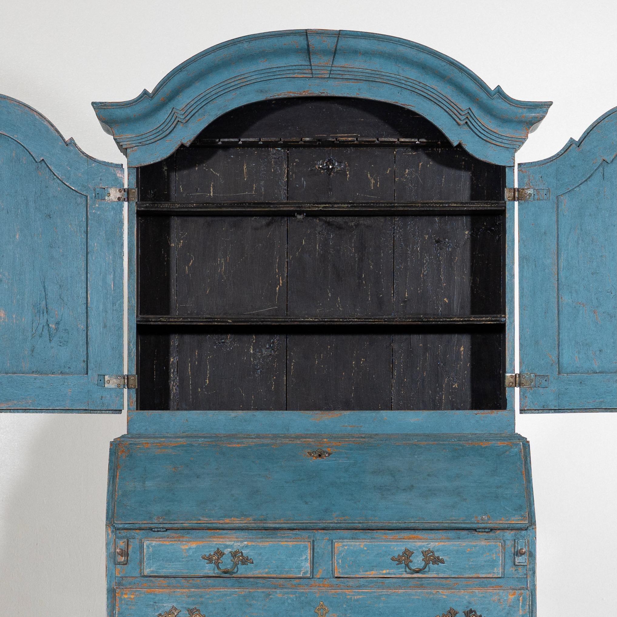 Lovely cabinet in a beautiful bluish colour with many carvings, circa 100 years old.