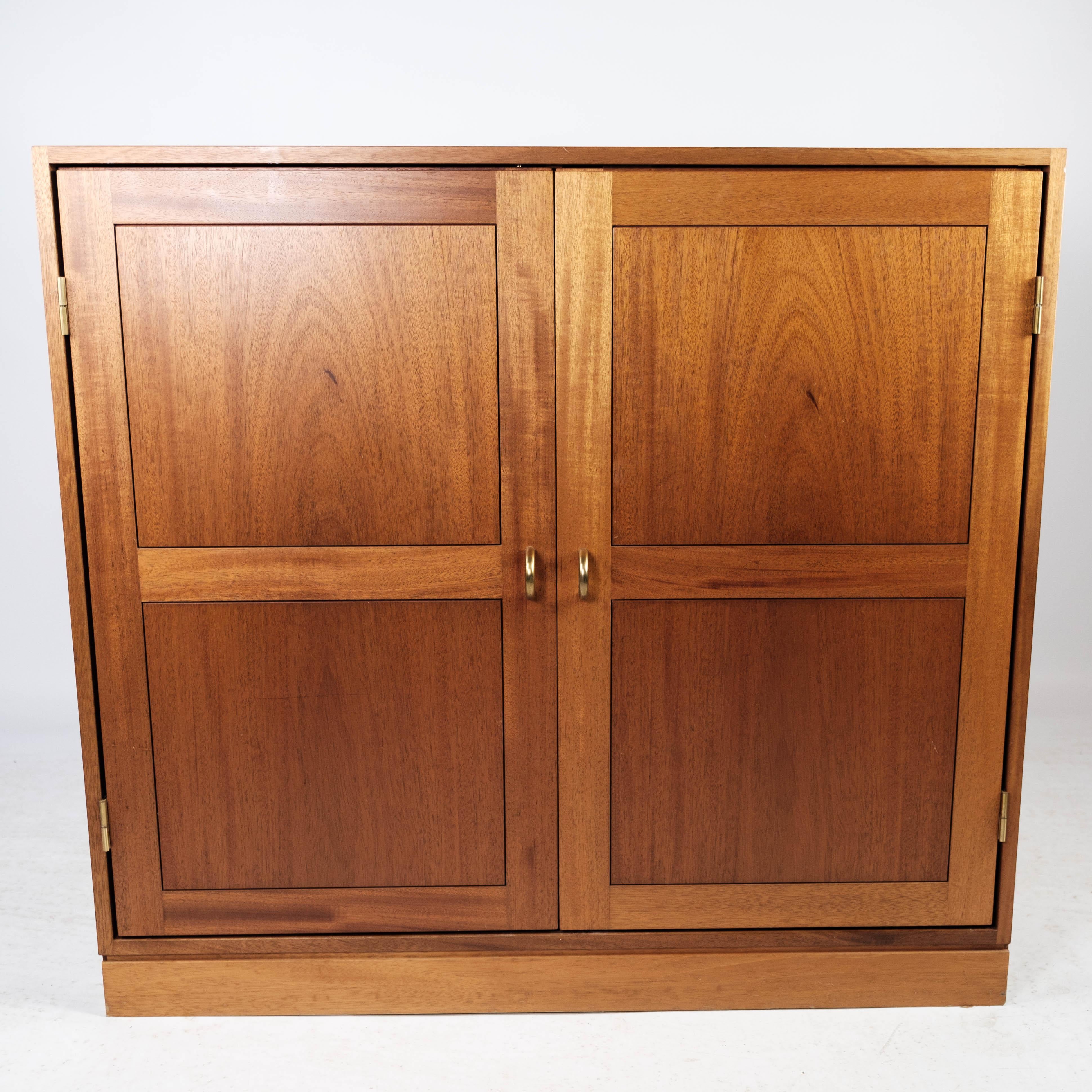 Get an authentic piece of Danish furniture history with this cabinet in light mahogany from the 1960s, created by the renowned Danish company Søborg Møbler. This cabinet is an iconic example of Danish design from this era, combining timeless