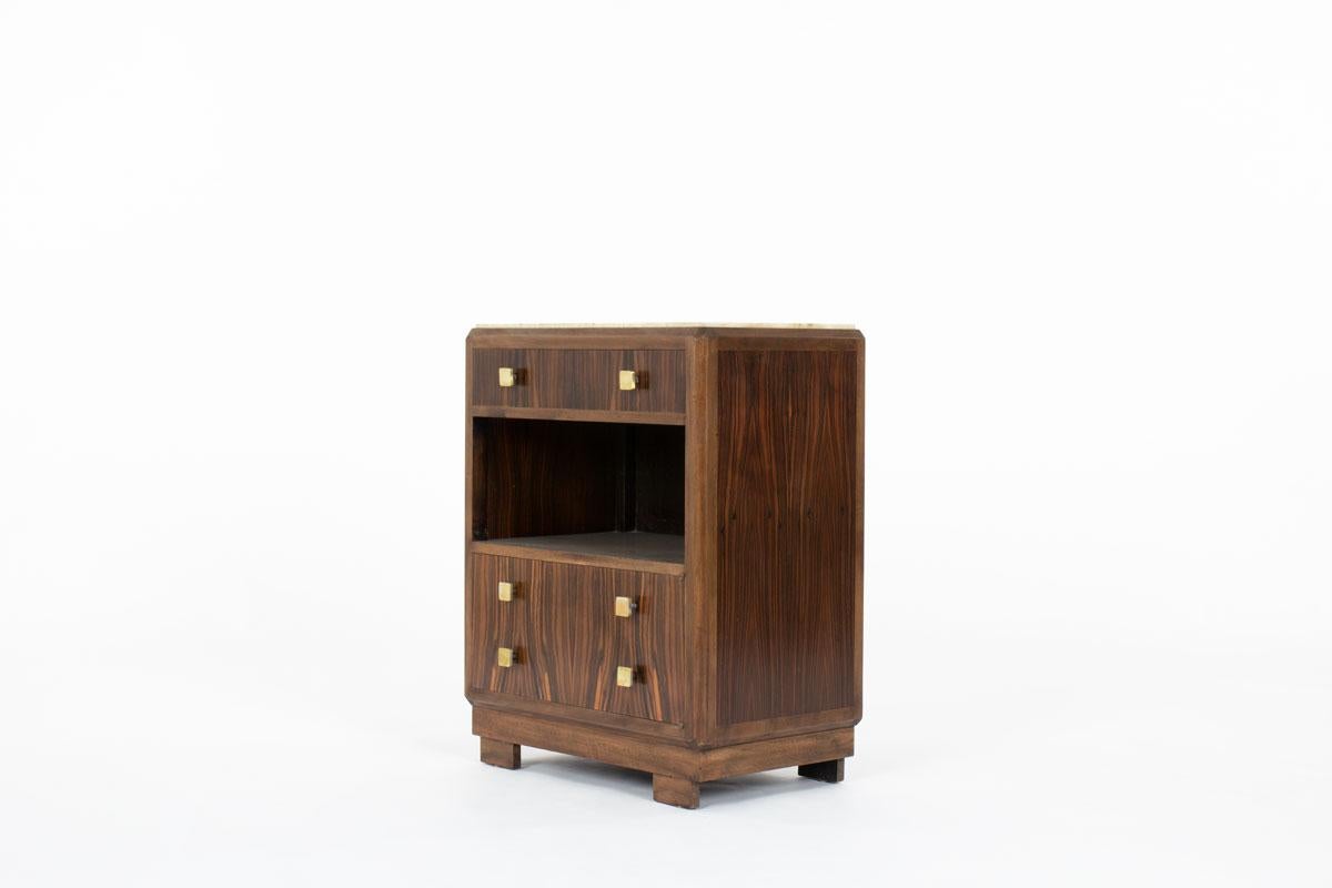 Elegant and unique, this 1930s Art Deco cabinet perfectly captures the refined aesthetic of the era. Crafted in Macassar ebony veneer with strikingly deep, contrasting grain patterns, it is subtly enhanced by rosewood accents that lend the piece a