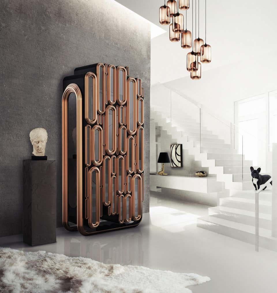 Cabinet in metallic and black lacquered wood
Estimated production time: 15-16 weeks
Measures: Height 83.47 in. (212 cm)
Width 40.56 in. (103 cm)
Depth 22.45 in. (57 cm)

The Bar Cabinet is a fusion of modern and classic elements into a highly