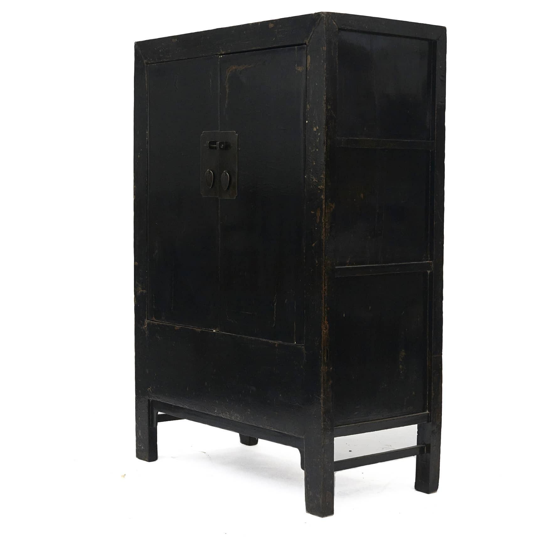 Original black lacquer cabinet with a pair of doors.

The front with a layer of 