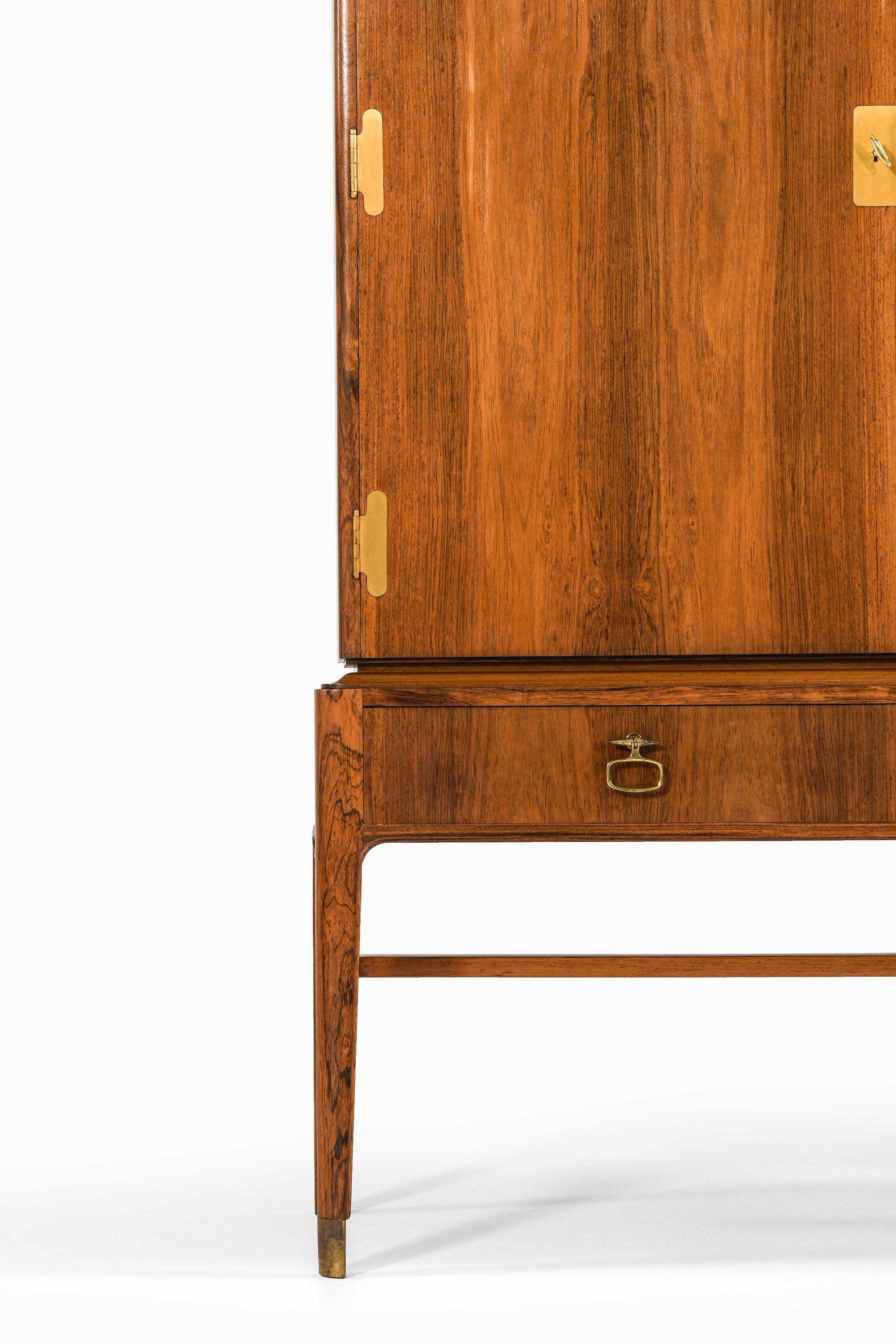 Mid-Century moderno Mobile in palissandro e ottone di Ernst Kühn, anni '40 in vendita