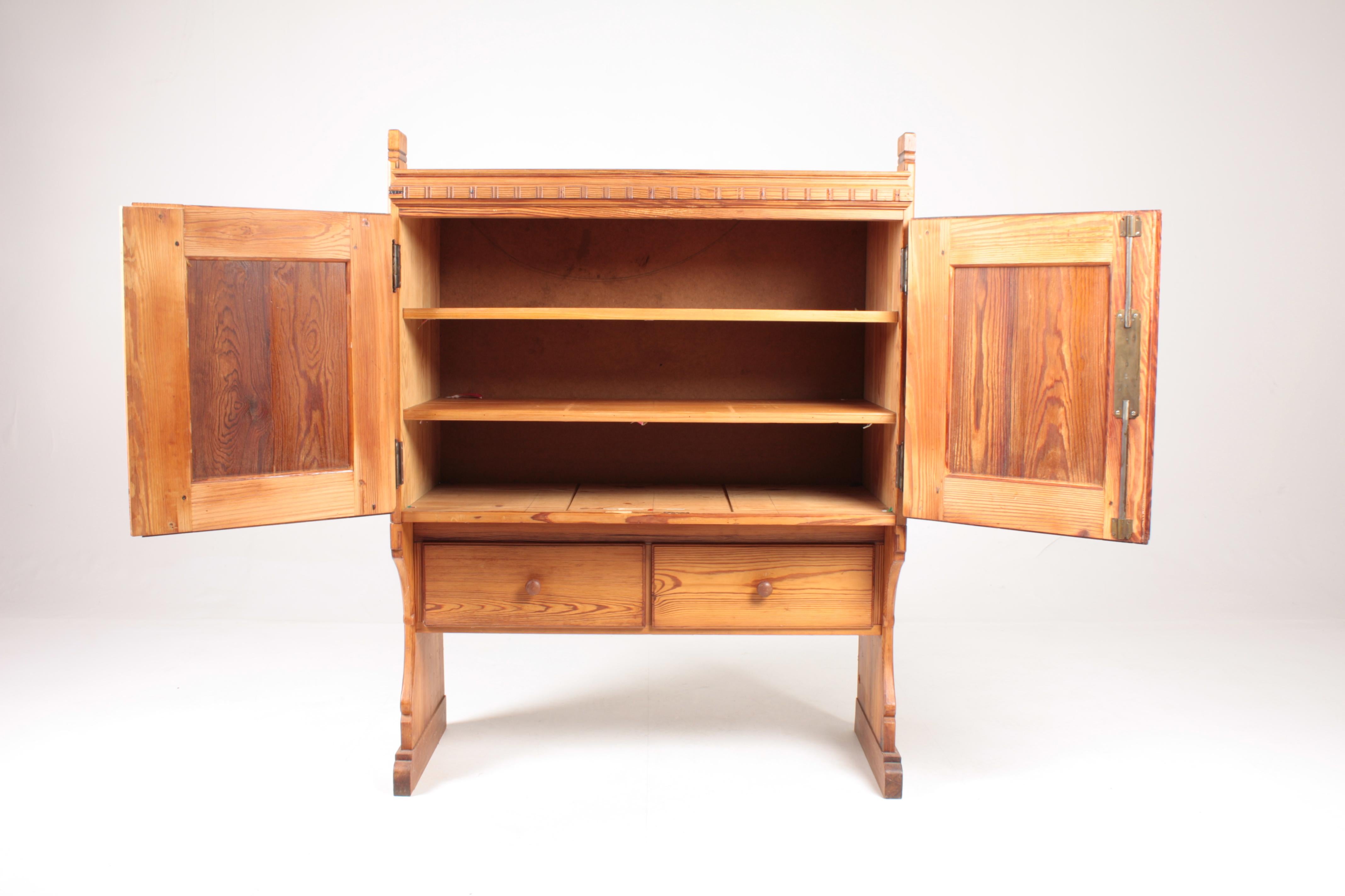 Cabinet in patinated solid pine. Designed by MAA. Martin Nyrop as interior for Copenhagen town hall in 1905. Made in Denmark by Cabinetmaker Rud Rasmussen cabinetmakers. Great condition.

     