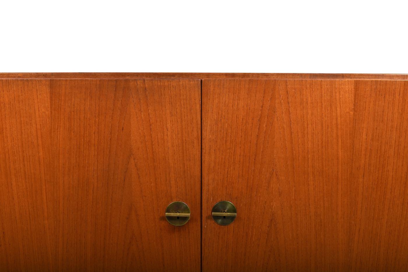 Sideboard / cabinet, model no.232 by Børge Mogensen for FDB Møbler. Brass handles. He designed his China Series in 1960s. Made in teak and produced 1960s. Early model with big drawer inside.