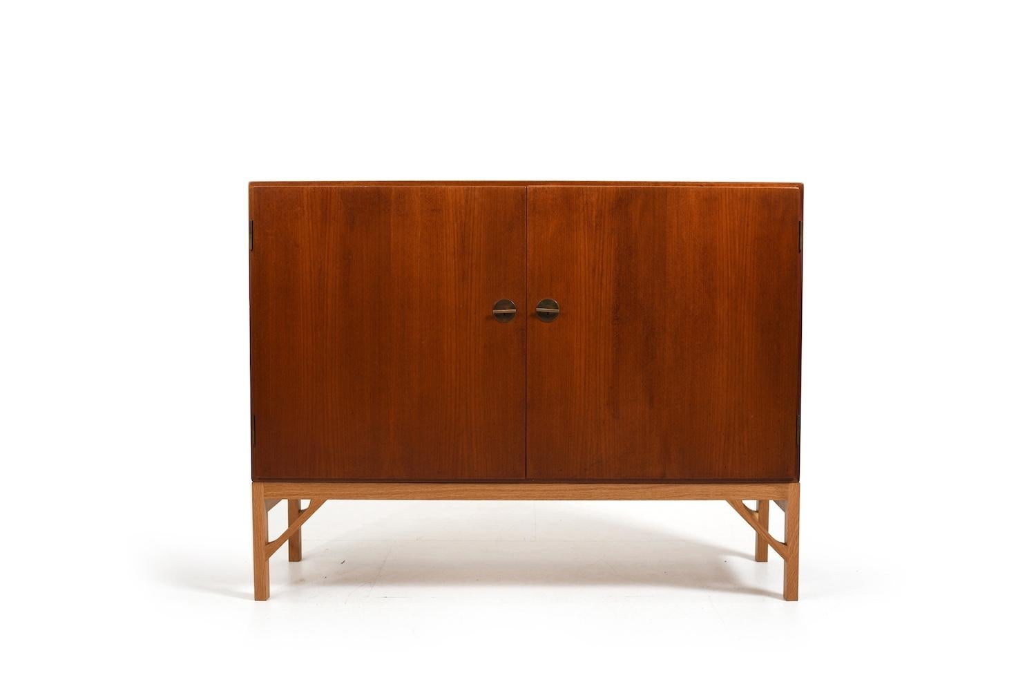 Sideboard / cabinet, model no.232 by Børge Mogensen for FDB Møbler Denmark. Brass handles. He designed his China Series in 1960s. Made in teak and base in oak. Produced 1960s.

Note. Please have a look on the matching bookcases in our collection.
