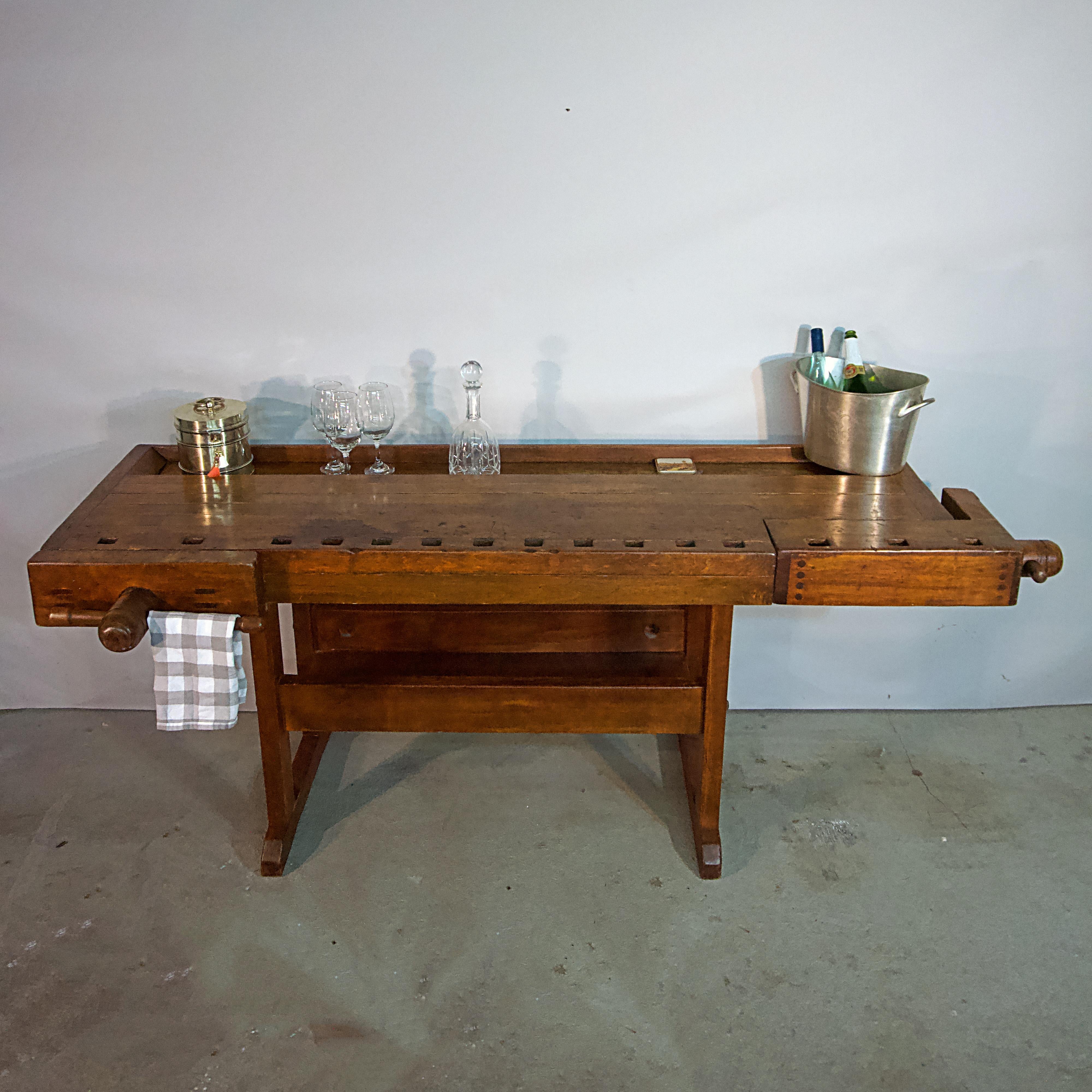 Functional early 20th century cabinet makers work bench 
as sideboard, serving table or bar.