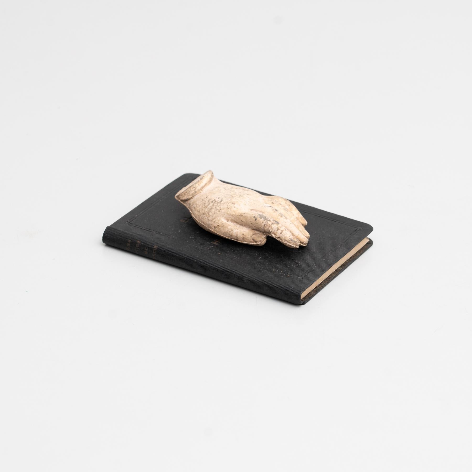 Cabinet of curiosities of plaster pieces and antique book artwork.    Made in traditional Catalan atelier in Olot, Spain, circa 1950.    Olot has a long tradition in the production of sculptures and religious imagery. The art and industry of