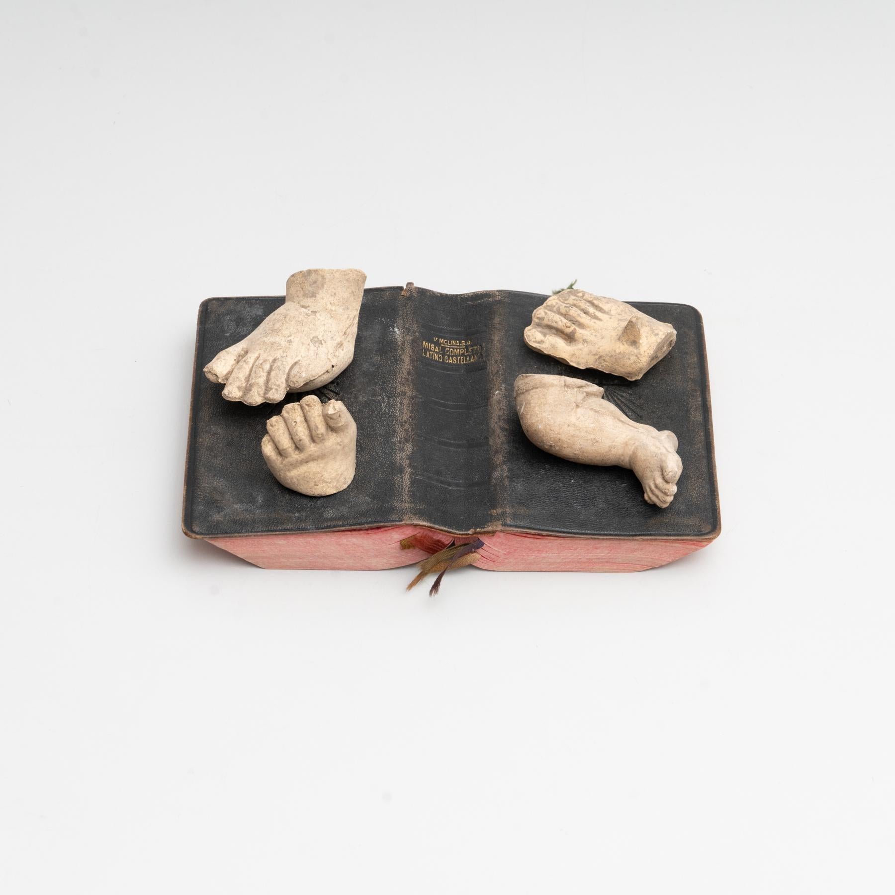 Cabinet of curiosities of plaster pieces and antique book artwork.    Made in traditional Catalan atelier in Olot, Spain, circa 1950.    Olot has a long tradition in the production of sculptures and religious imagery. The art and industry of