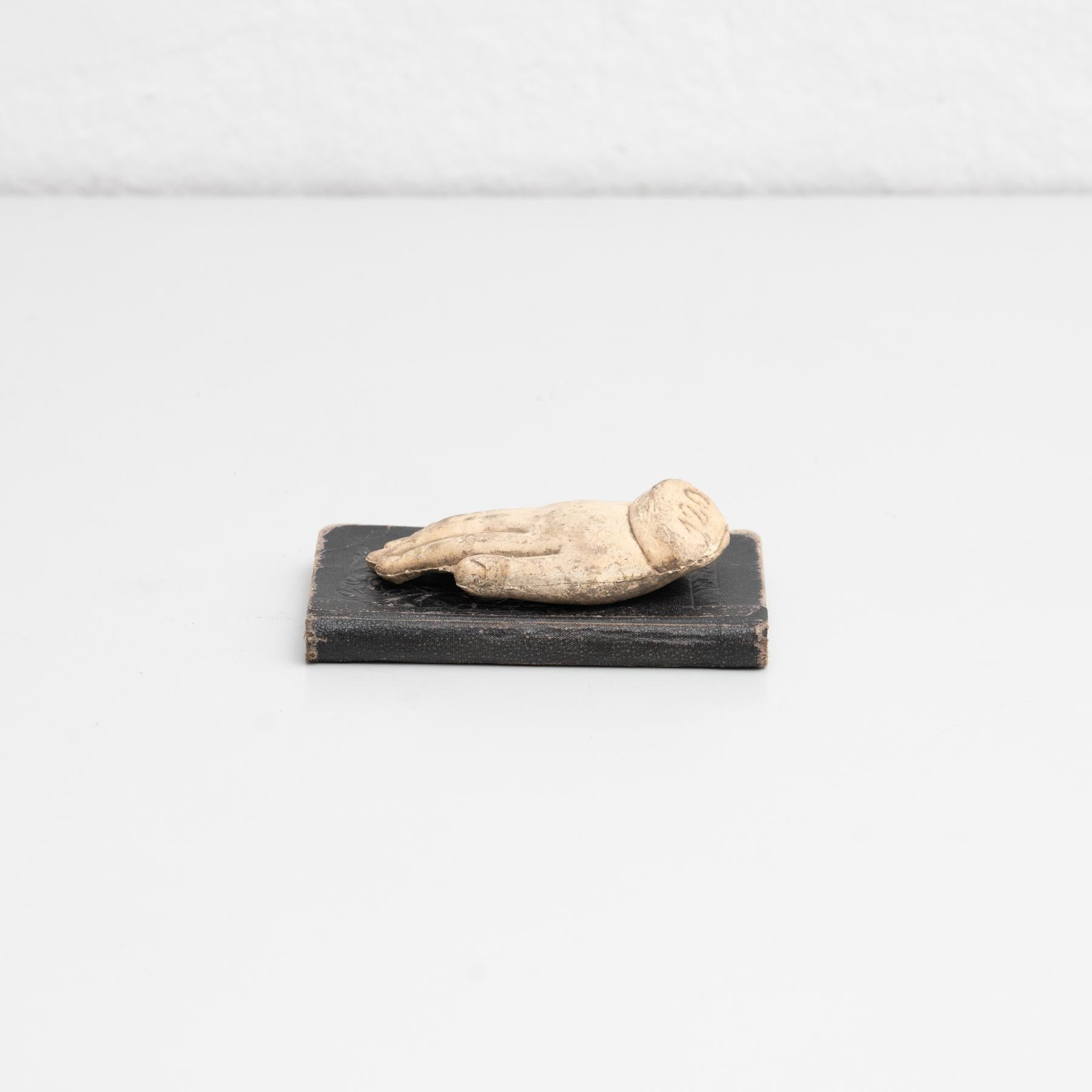 Cabinet of curiosities of plaster pieces and antique book artwork.    Made in traditional Catalan atelier in Olot, Spain, circa 1950.    Olot has a long tradition in the production of sculptures and religious imagery. The art and industry of