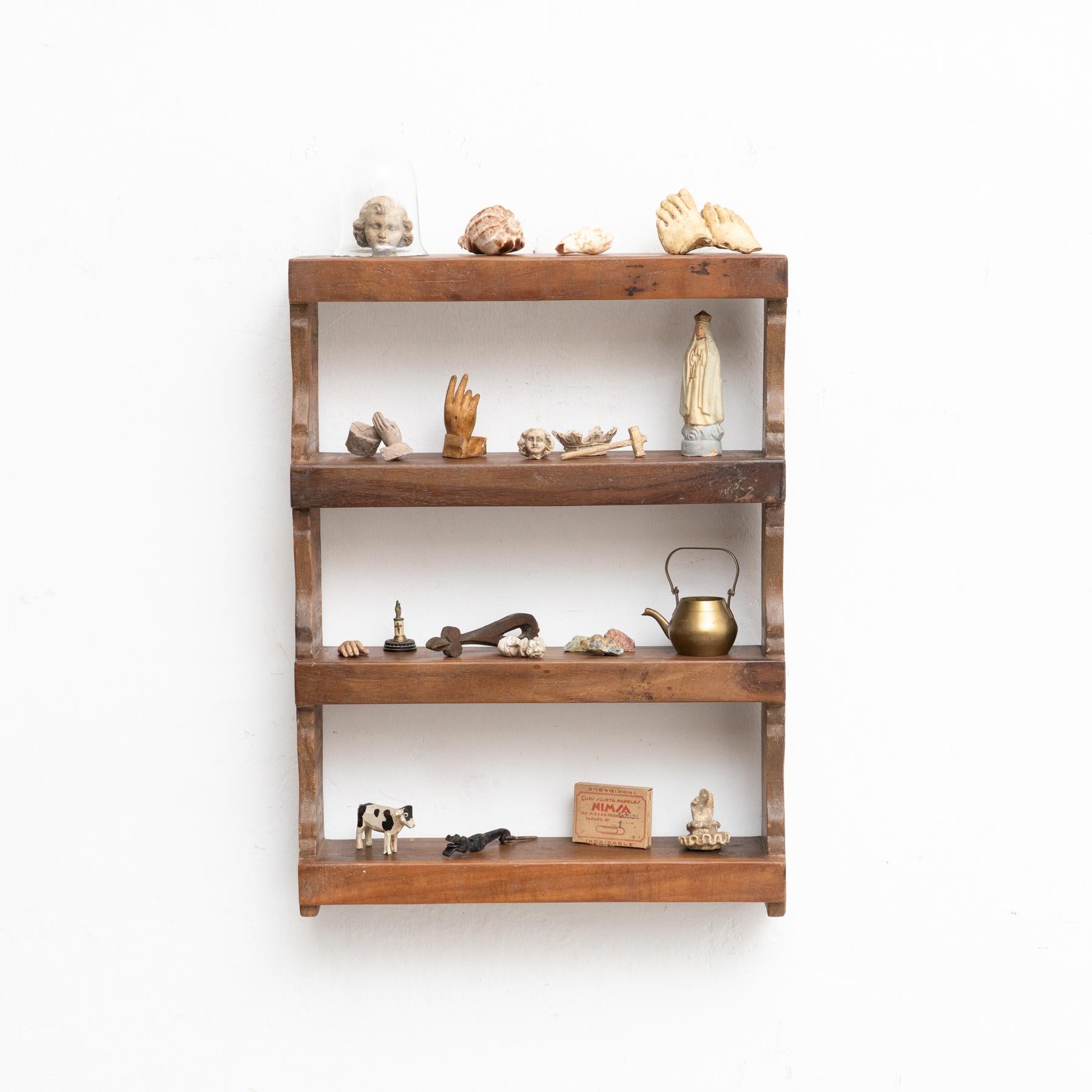 Cabinet of curiosities of plaster figures and pieces in a wooden shelve.

Made in Spain, circa 1950.

In original condition, with minor wear consistent with age and use, preserving a beautiful patina.

Materials:
Plaster.
Wood

The