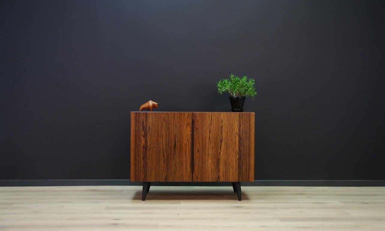 Splendid cabinet from the 1960s-1970s, Minimalist form - Danish design. Furniture finished with rosewood veneer. Spacious interior with a shelf. Preserved in good condition (minor scratches) - directly for use.

Dimensions: height 72 cm, width 100