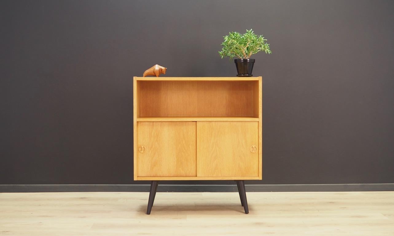 Original cabinet from the 1960s-1970s, Minimalist form - Danish design. The form is veneered with ash. Spacious bar behind the doors, and a bookshelf. Preserved in good condition (minor scratches and bruises) - directly for use.

Dimensions: