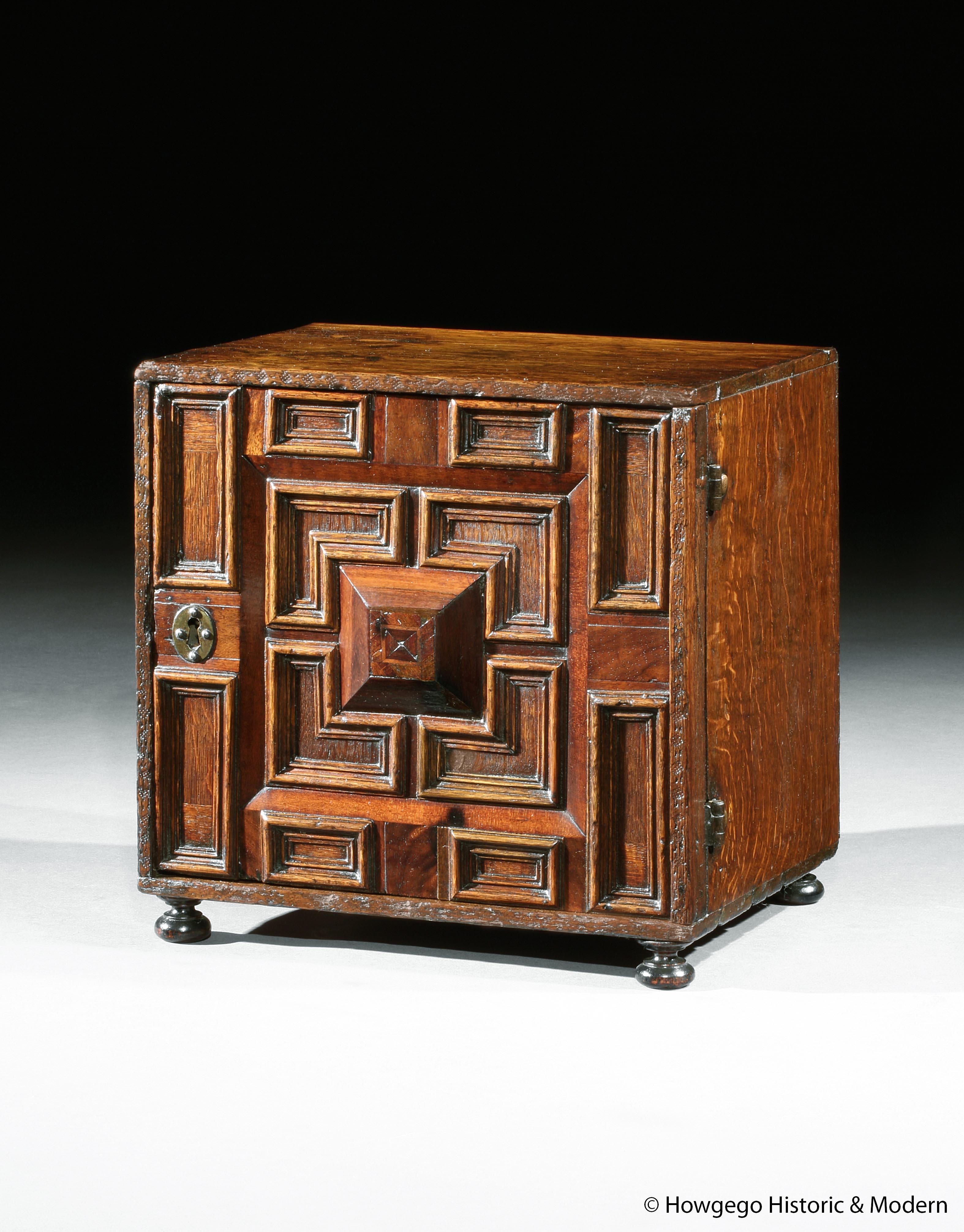 - Particularly fine example with deep cushion and geometric mouldings.
- Atmospheric piece with character
- Secret drawers add intrigue

A rare mid-17th century oak and cedar spice cabinet with geometric and cushion mouldings. The front with a