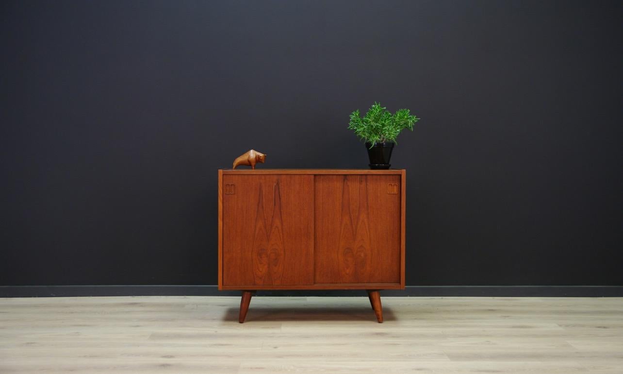 Stylish cabinet made in Sejling Skabe manufactory, from19 60s-1970s - Minimalist Danish design. Surface veneered with teak. Behind the sliding doors there are spacious shelves. Preserved in good condition (small bruises and scratches) - directly for