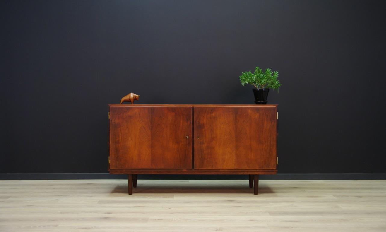 Classic cabinet from the 1960s-1970s, minimalist form - Danish design. Spacious interior with four drawers on the left side and two shelves on the right side. The form is veneered with rosewood. Has a key. Preserved in good condition (small dings