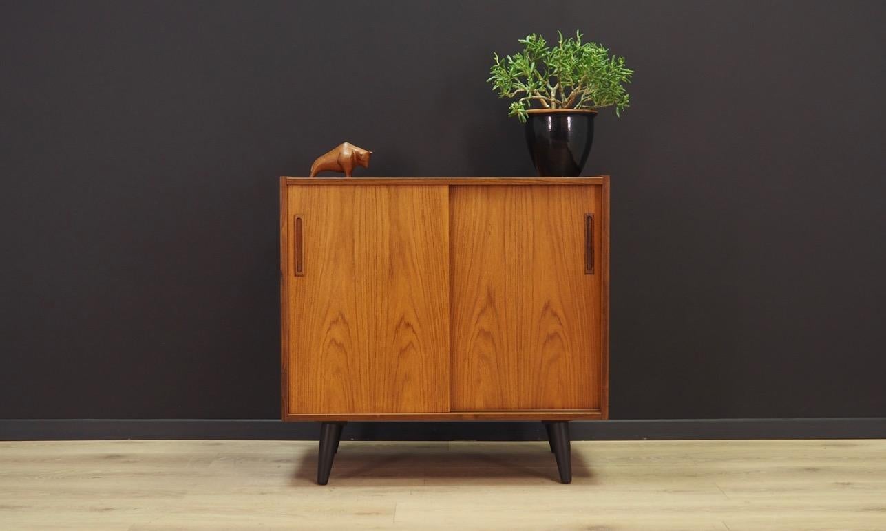 Fantastic cabinet from the 1960s-1970s. Scandinavian design, Minimalist form. Surface of the furniture finished with rosewood veneer. Shelf behind a sliding doors. Maintained in good condition (minor bruises and scratches), directly for