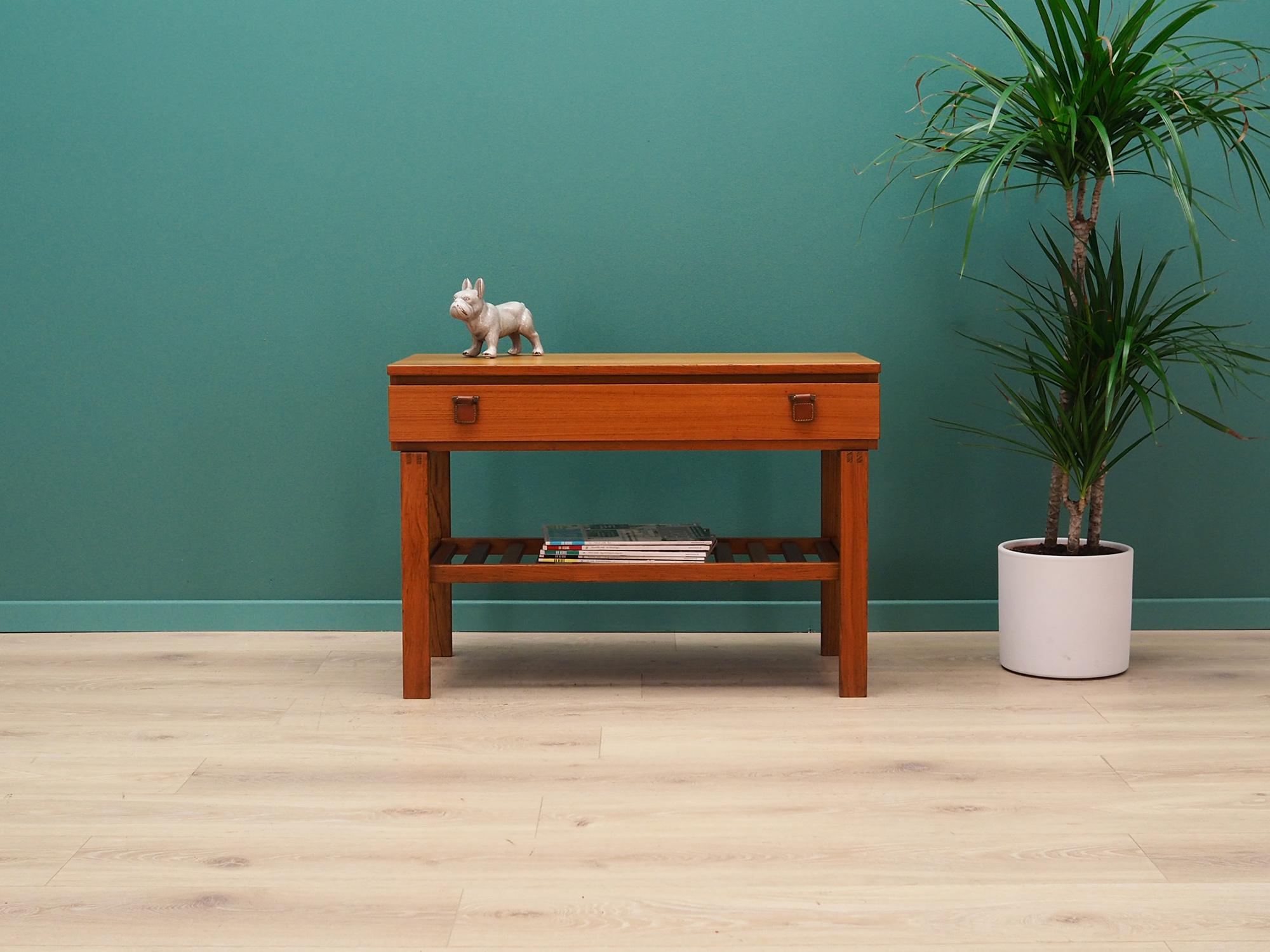 Exceptional cabinet from the 1960-1970s. Danish design, Minimalist form. Furniture finished with teak veneer. Cabinet has a drawer with leather handles and a shelf. Preserved in good condition (minor bruises and scratches) - directly for