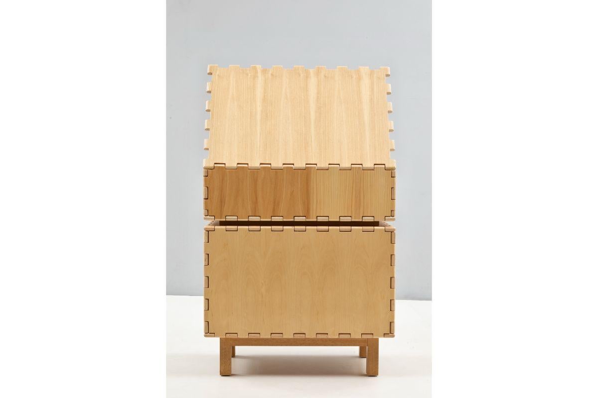 Cabinet with Display Box by Luis Pons
Dimensions: W 66 x D 44 x H 79 cm
Materials: Plywood, Walnut, Hand-Crafted

Also available in different colors,

Tangara envisions a new meaning for the wood hinge, a feature that was previously crafted by