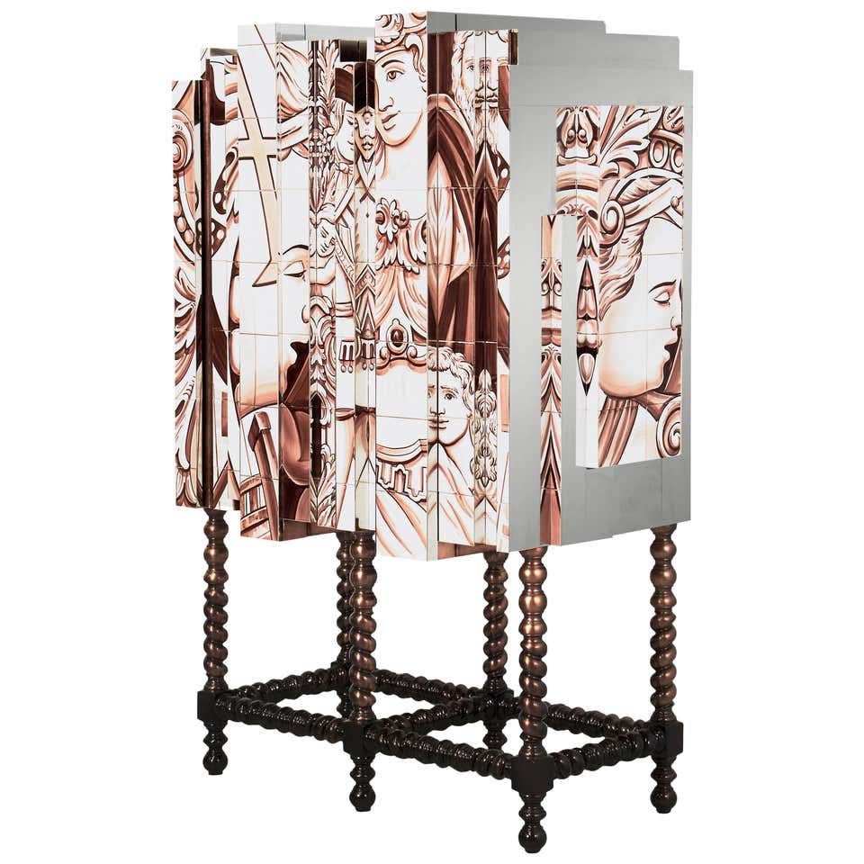 Cabinet with hand painted tiles
Estimated production time: 15-16 weeks
Copper leaf with translucent
and chocolate finish, hand painted tiles,
Bronze glass, polished stainless steel, bronze
mirror
Measures: Height 64.97 in. (165 cm)
Width 43.31 in.