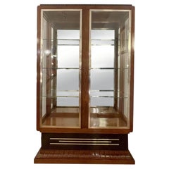 Dreiseitig verglaster Schrank Frankreich um 1930. Rosenholzfurnier.
