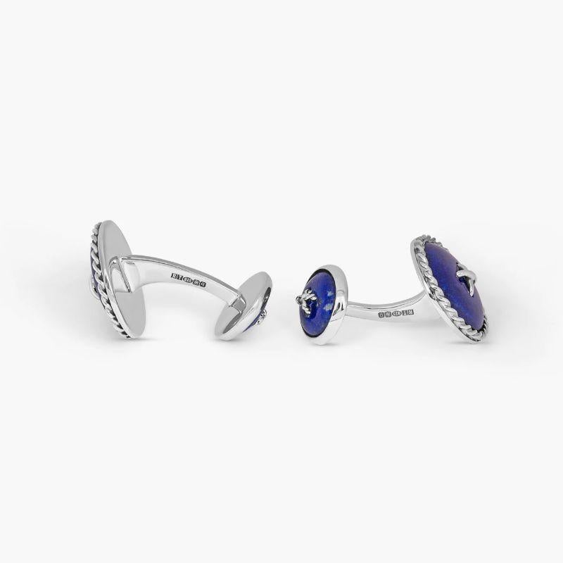 Cable Button Double Ended Cufflinks with Lapis in Sterling Silver

These cufflinks feature a double ended button created with semi precious stone. This is encased within rhodium plated sterling silver and finished with silver cable through the