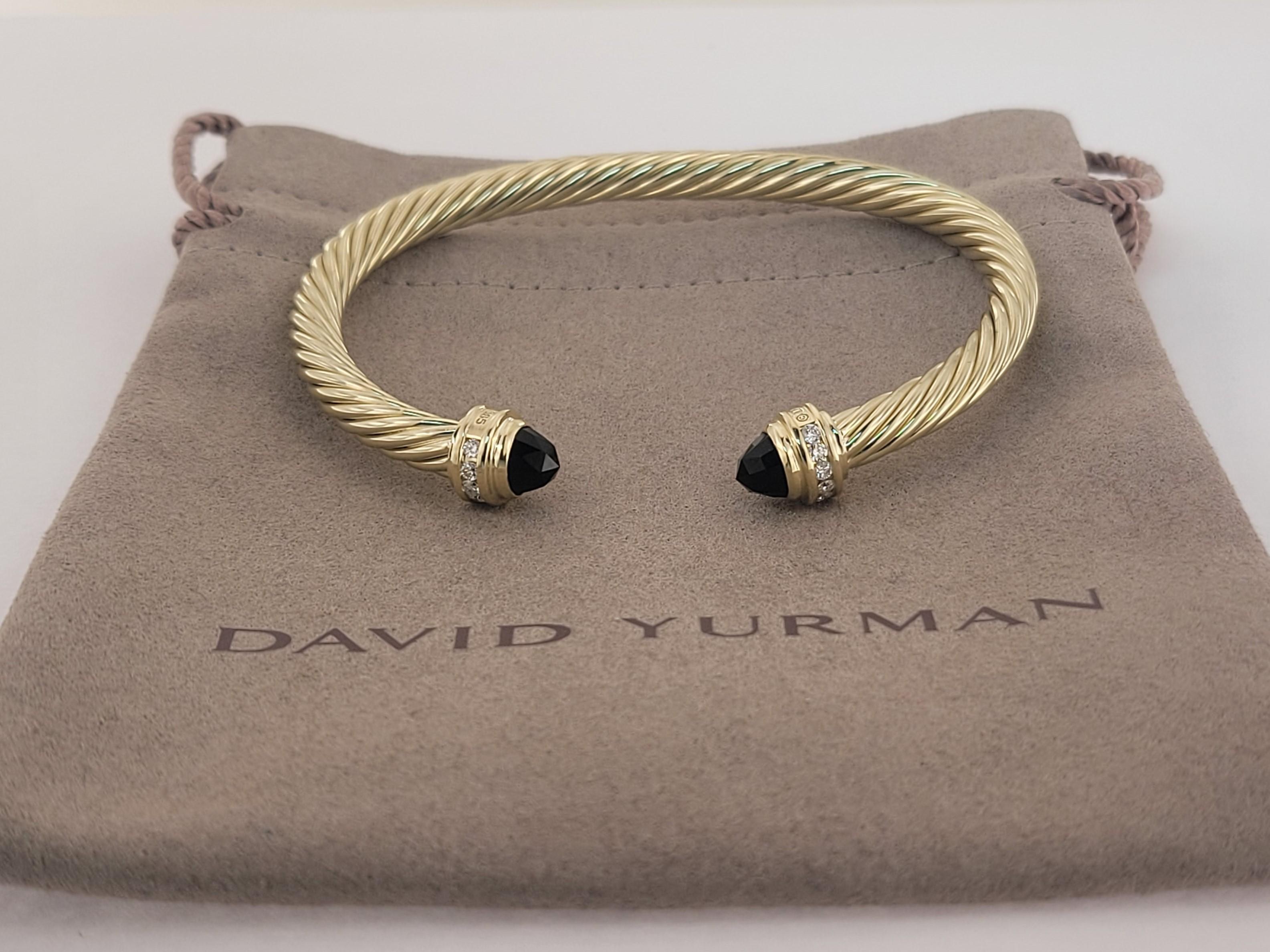 Brand David Yurman
Size Medium
Gender Women
Condition never worn
14K Yellow Gold
Black onyx 
Pave Diamond 0.41 total carat weight
Width 5mm
Weight 15.5gr