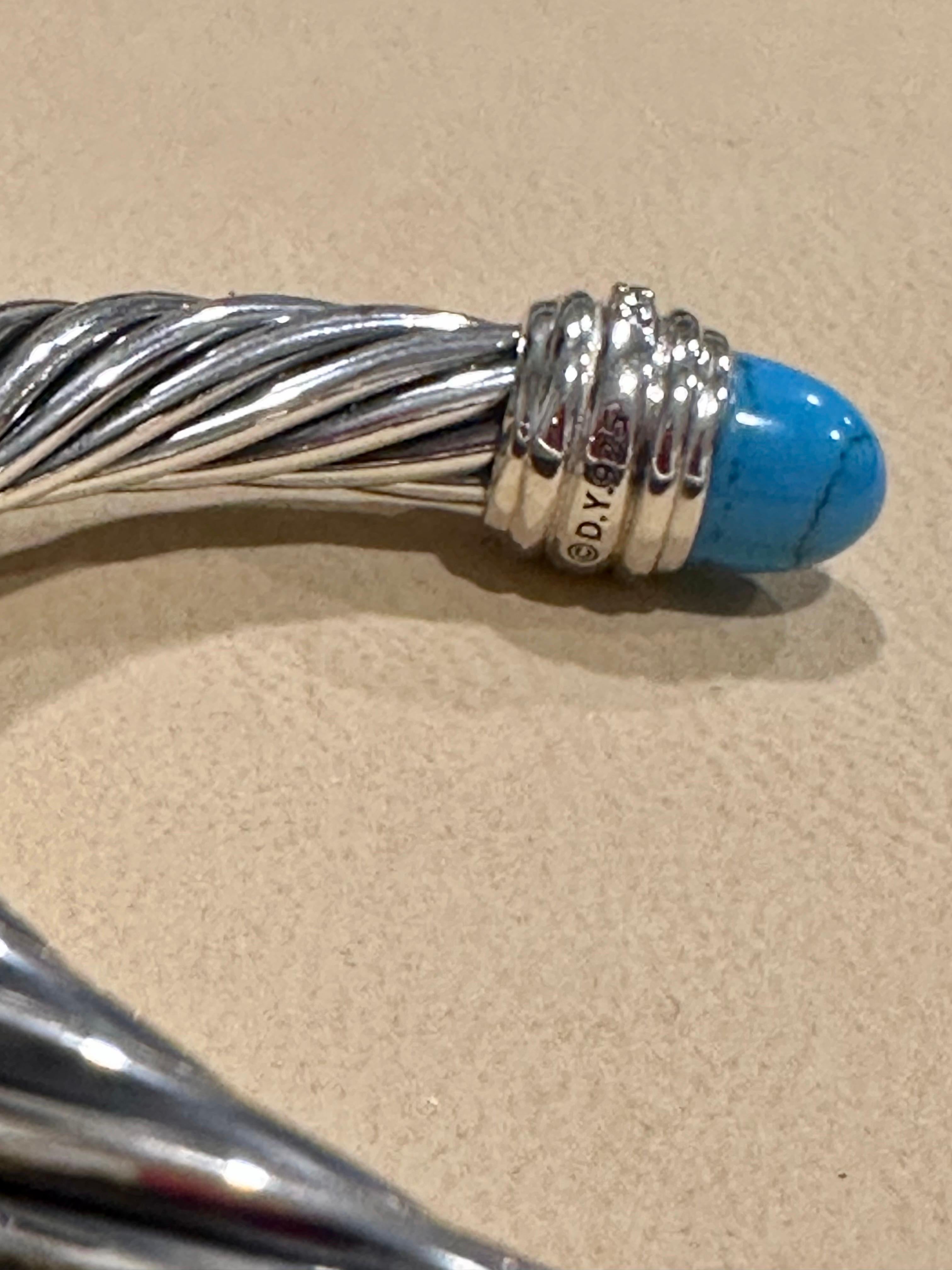 Its a pre owned Bangle 
David Yurman�’s artistic signature, Cable began as a bracelet that he hand-twisted from 50 feet of wire. For the past 30 years, he has evolved the twisted helix into a myriad of designs.
 
Sterling silver weight with stone is