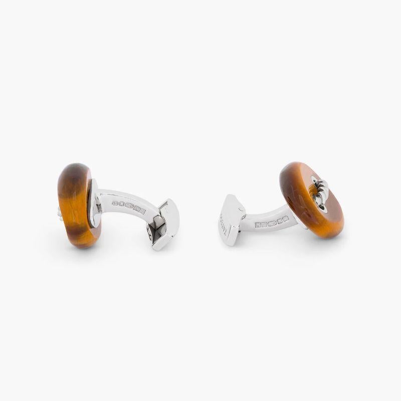 Cable Marine Link Silver Cufflinks with Brown Tiger Eye

Inspired by the marine knot these semi-precious oval cufflinks have the signature Tateossian cable threaded through the silver holes. The surface of the marine link has a gentle curvature to