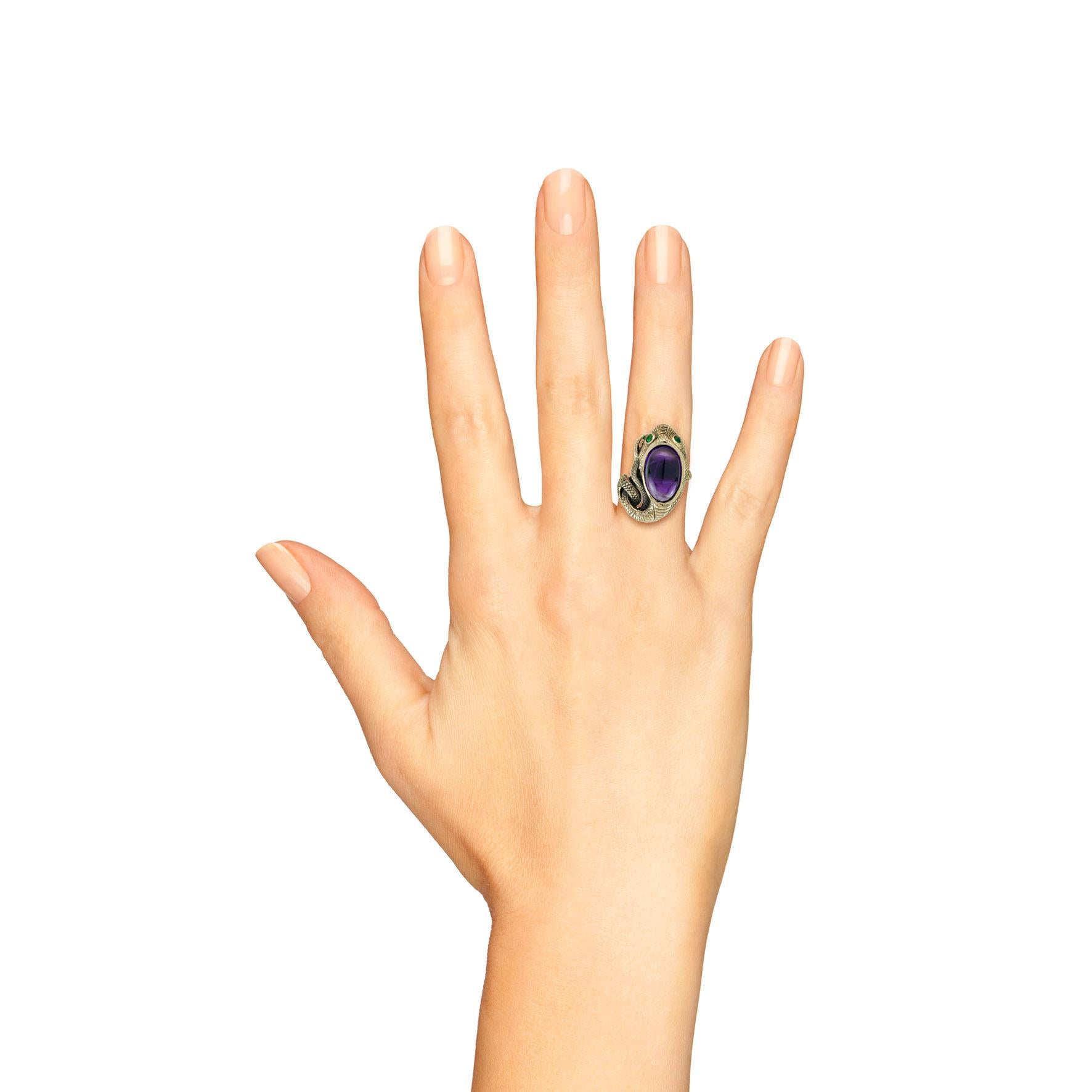 Embrace the allure of vintage elegance with our stunning Cabochon Amethyst and Emerald Antique Style Snake Ring in Yellow Gold. This exquisite piece features a beautifully crafted snake, symbolizing rebirth and transformation, adorned with an