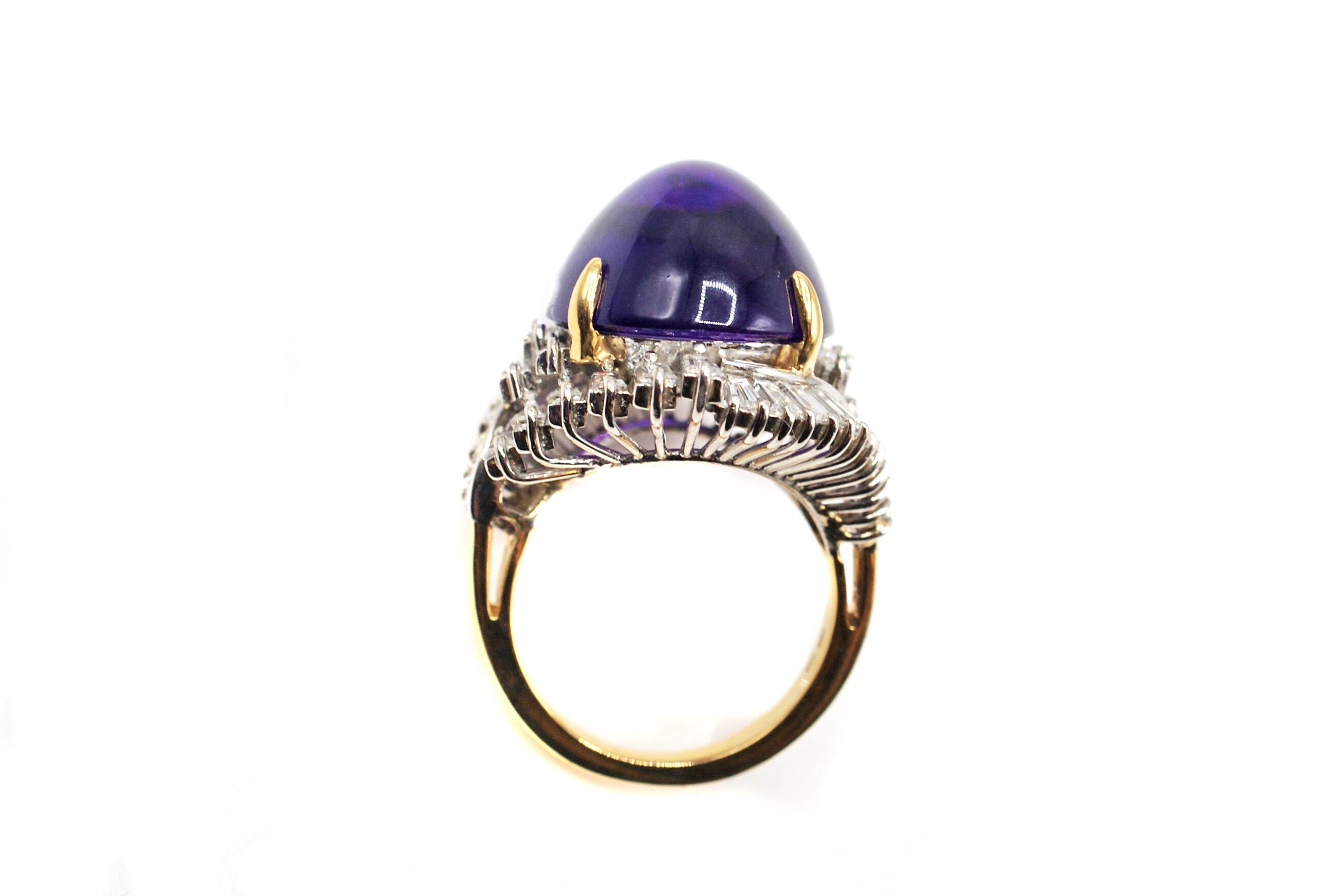 A gorgeous rich deep purple Amethyst cabochon has been chosen for the center piece of this stylish 1970s ring. Amethysts with this strong color saturation are usually found in Siberia and are quite rare these days. The perfect cut of this oval