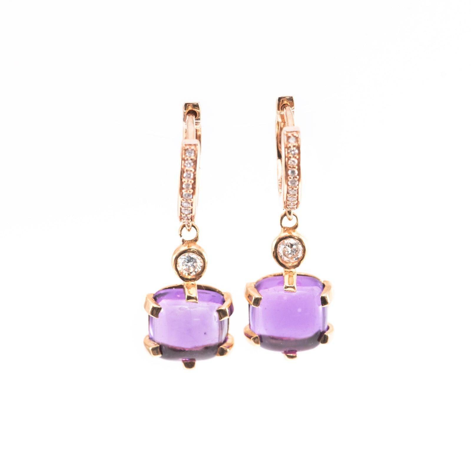 An amazing pair of cabochon amethyst earrings that goes with any outfit! 

Set in a 6 Prong head with a bezel round diamond attached all in 18K Rose Gold, these earrings will have you feeling beautiful!
