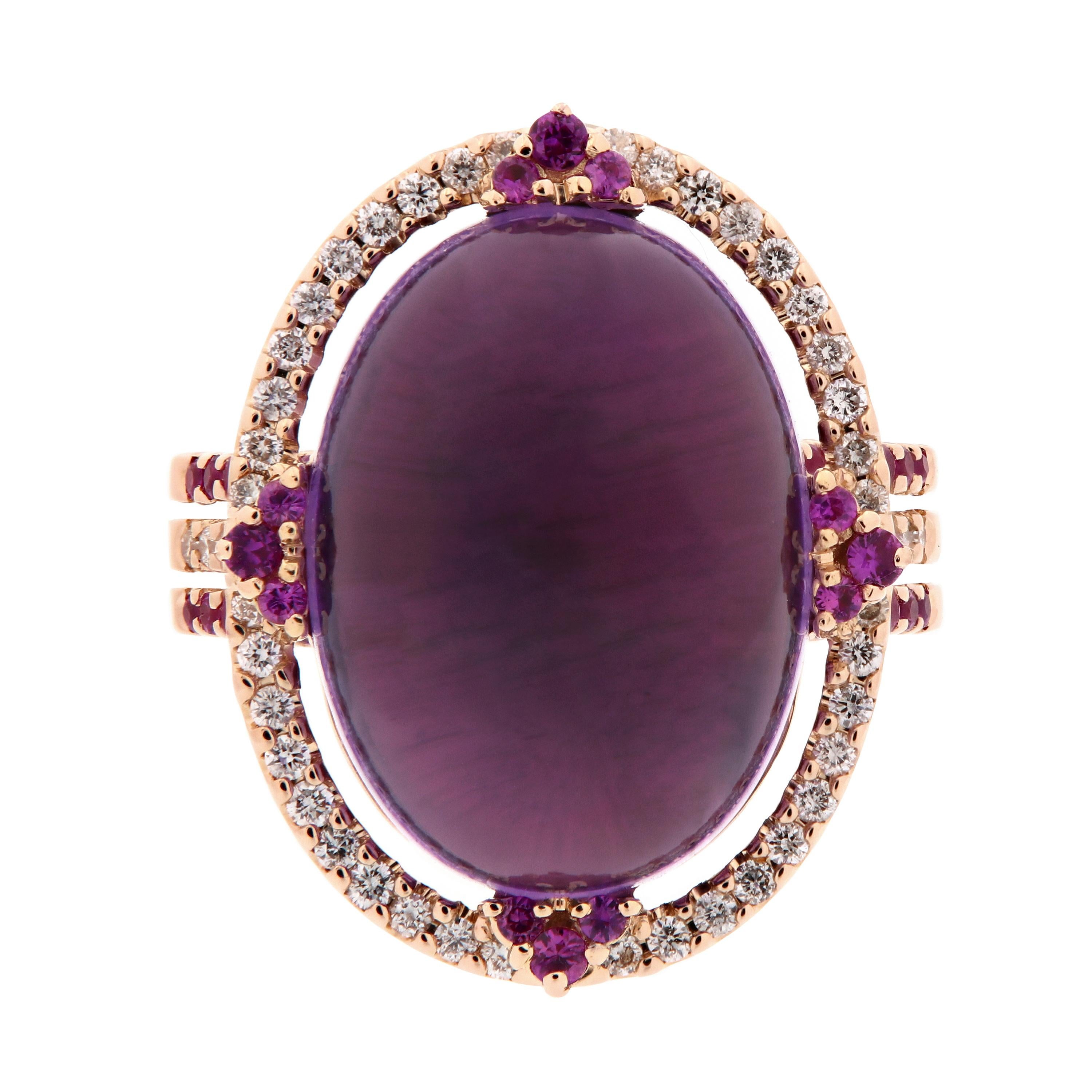 Spring is in the air & this rings beautiful colors echo that fact! Stunning in every way, this 18k rose gold cocktail ring features a cabochon cut amethyst surrounded by pink sapphires and diamonds. Ring size 6.5.

Amethyst 15.12 ct
Diamonds 0.53