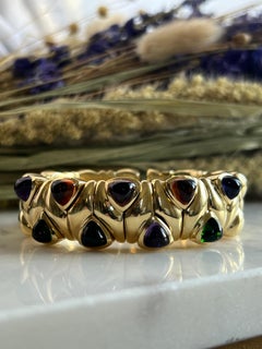 Manchette flexible en or 18 carats, améthyste, tourmaline, citrine, iolite, grenat rhodolite