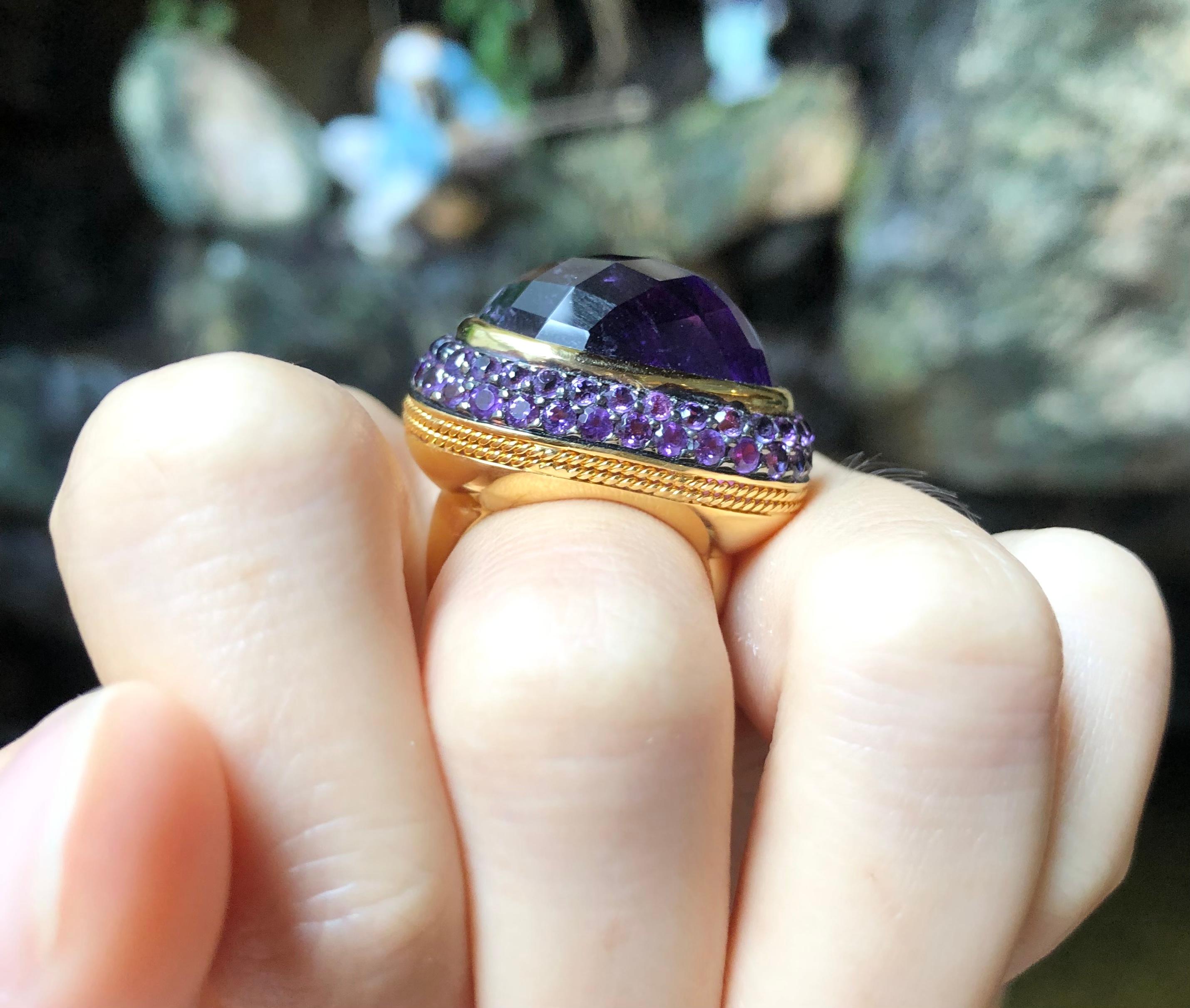 Cabochon Amethyst 21.61 carats with Amethyst 2.15 carats Ring set in 18 Karat Gold Settings

Width:  2.6 cm 
Length: 2.1 cm
Ring Size: 54
Total Weight: 18.38 grams

