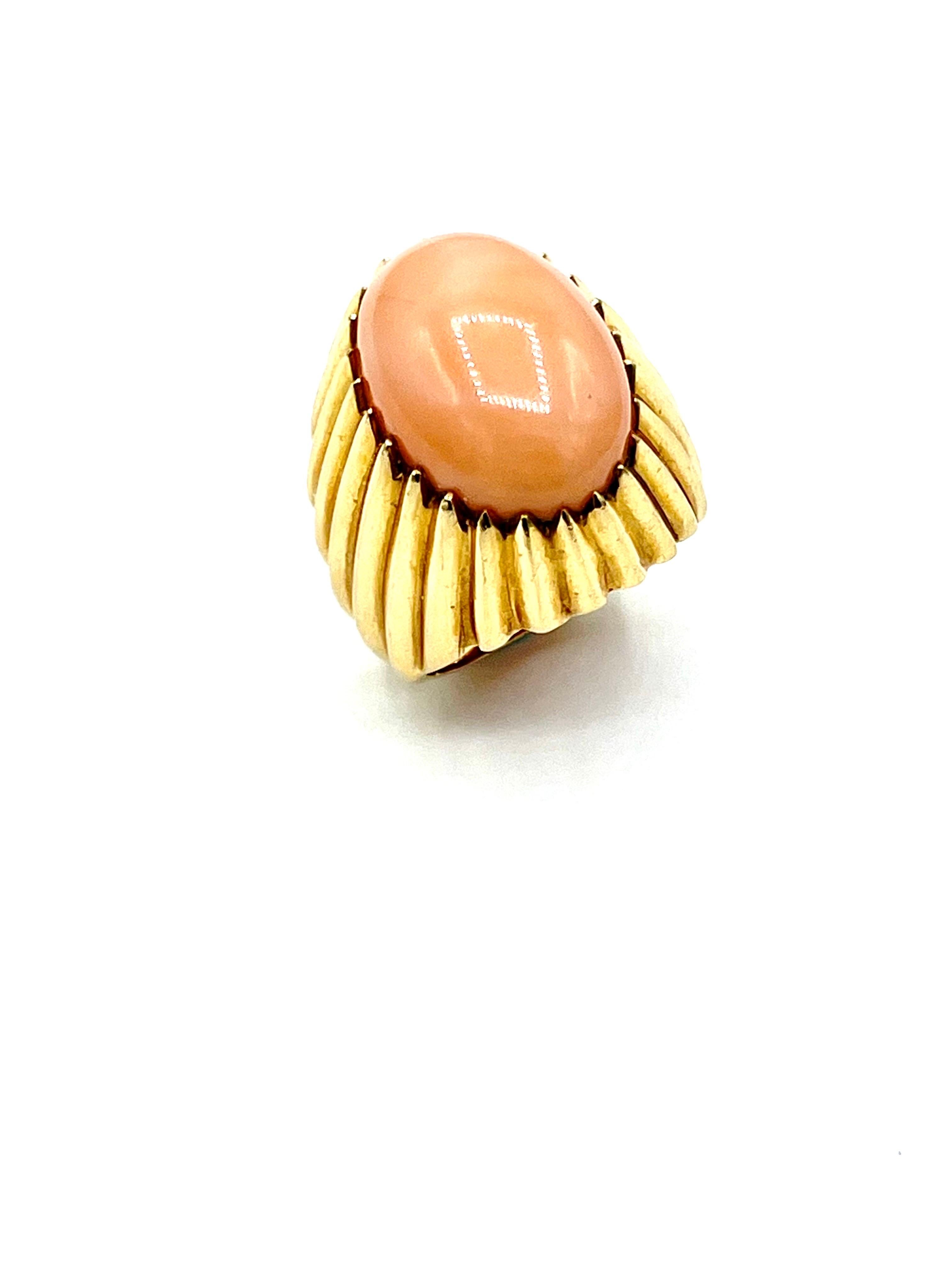 A gorgeous angel skin Coral cocktail ring!  The Coral is bezel set in a high polished bombe' textured gold, with a tapering shank.  The Coral measures 18.10 x 13.20mm.  The ring is made in 14K yellow gold, and is currently a size 6.75, and can be
