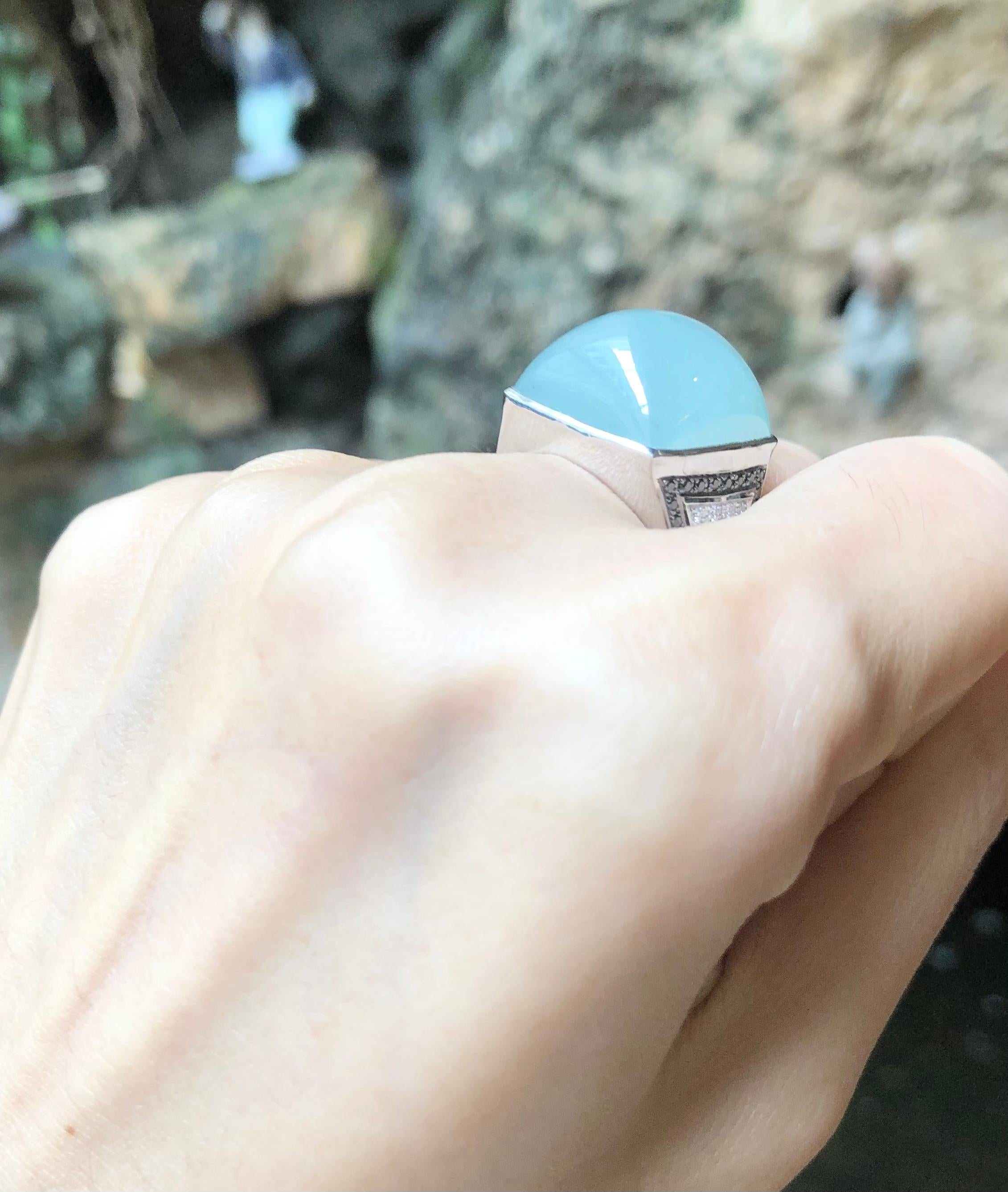 Contemporary Cabochon Aquamarine with Diamond and Black Diamond Ring in 18 Karat White Gold For Sale