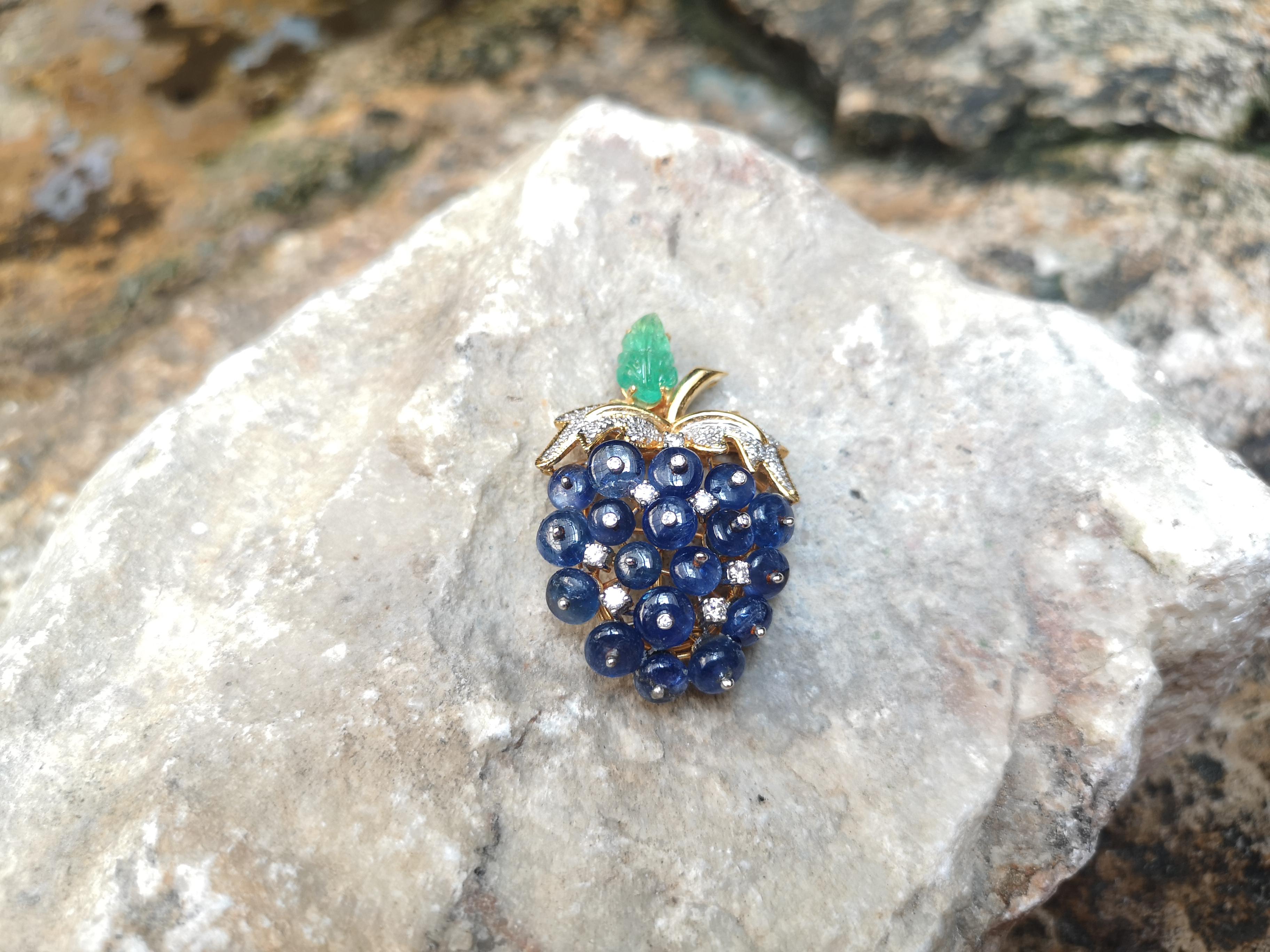 Cabochon Blue Sapphire 20.00 carats with Cabochon Emerald 1.80 carats and Diamond 0.40 carat Brooch set in 18 Karat Gold Settings

Width:  3.0 cm 
Length: 4.7 cm
Total Weight: 17.61 grams

