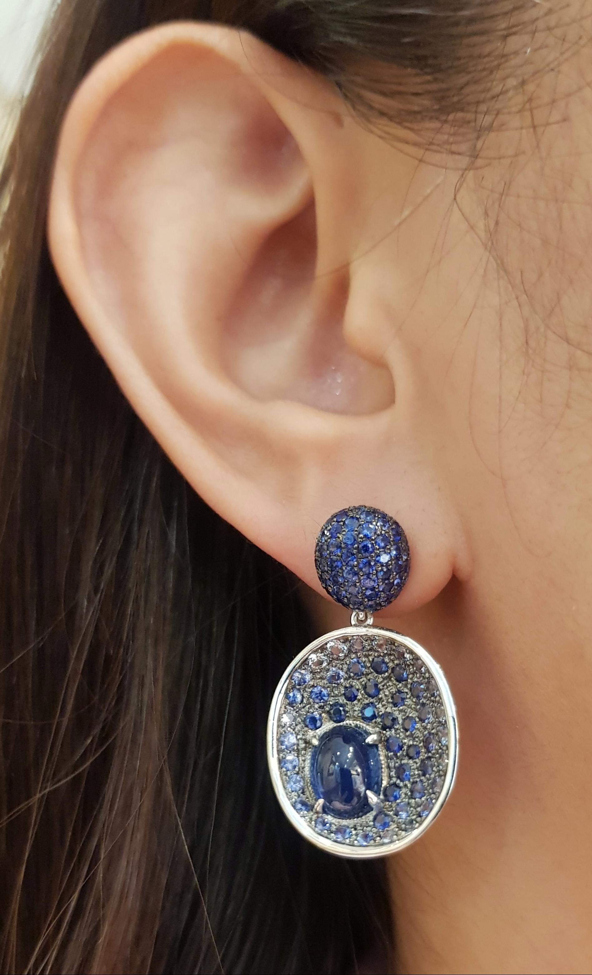 Cabochon Blue Sapphire 7.60 carats with Blue Sapphire 6.82 carats Earrings set in 18 Karat White Gold Settings

Width: 1.8 cm 
Length: 3.4 cm
Total Weight: 15.38  grams

