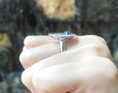 Cabochon Blue Sapphire with Blue Sapphire Rings Set in 18 Karat White Gold