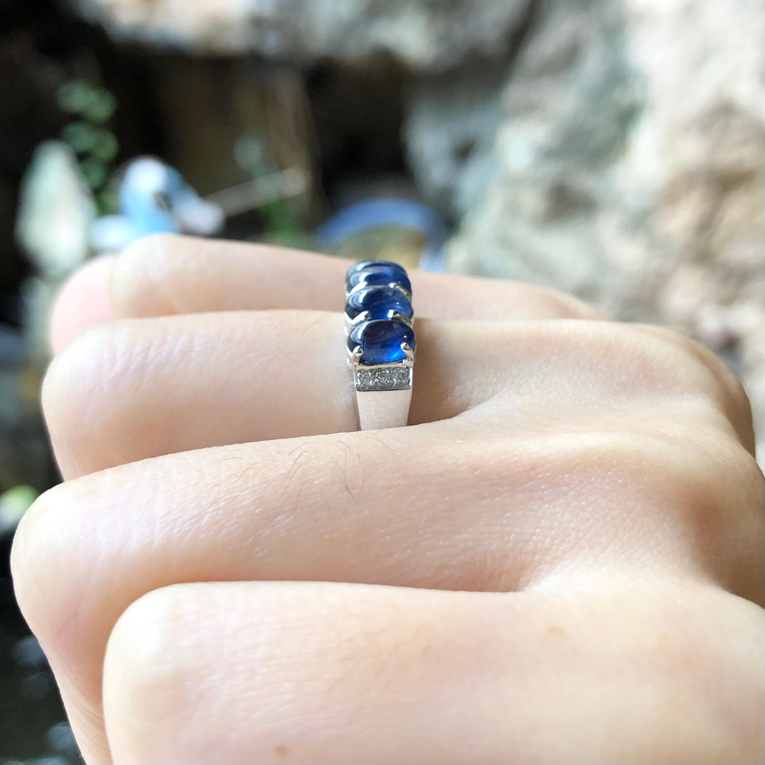 Contemporary Cabochon Blue Sapphire with Cubic Zirconia Ring set in Silver Settings For Sale