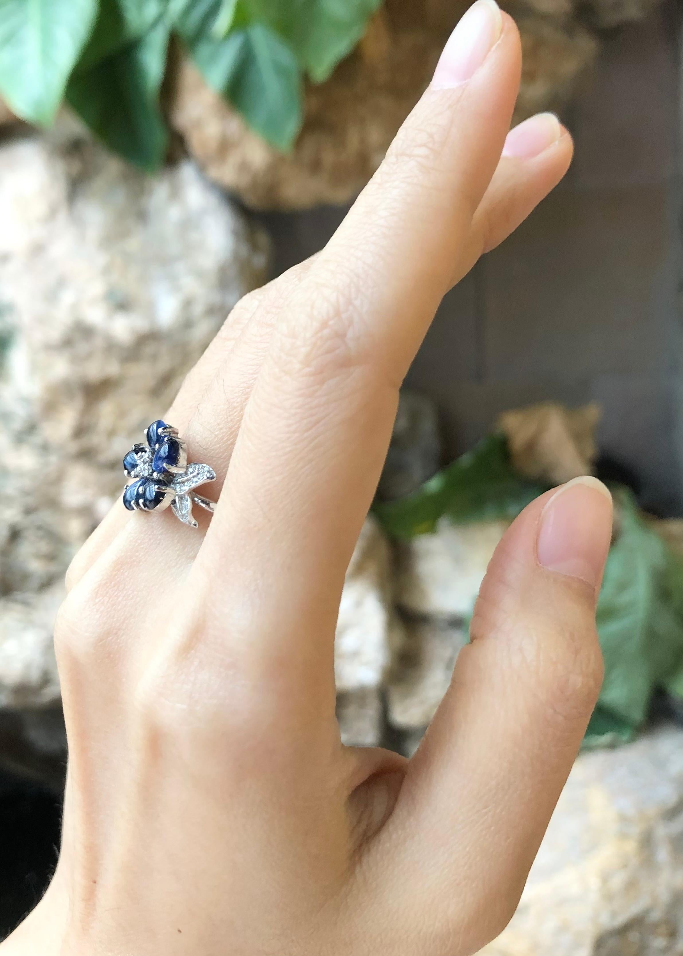 Contemporary Cabochon Blue Sapphire with Cubic Zirconia Ring set in Silver Settings For Sale