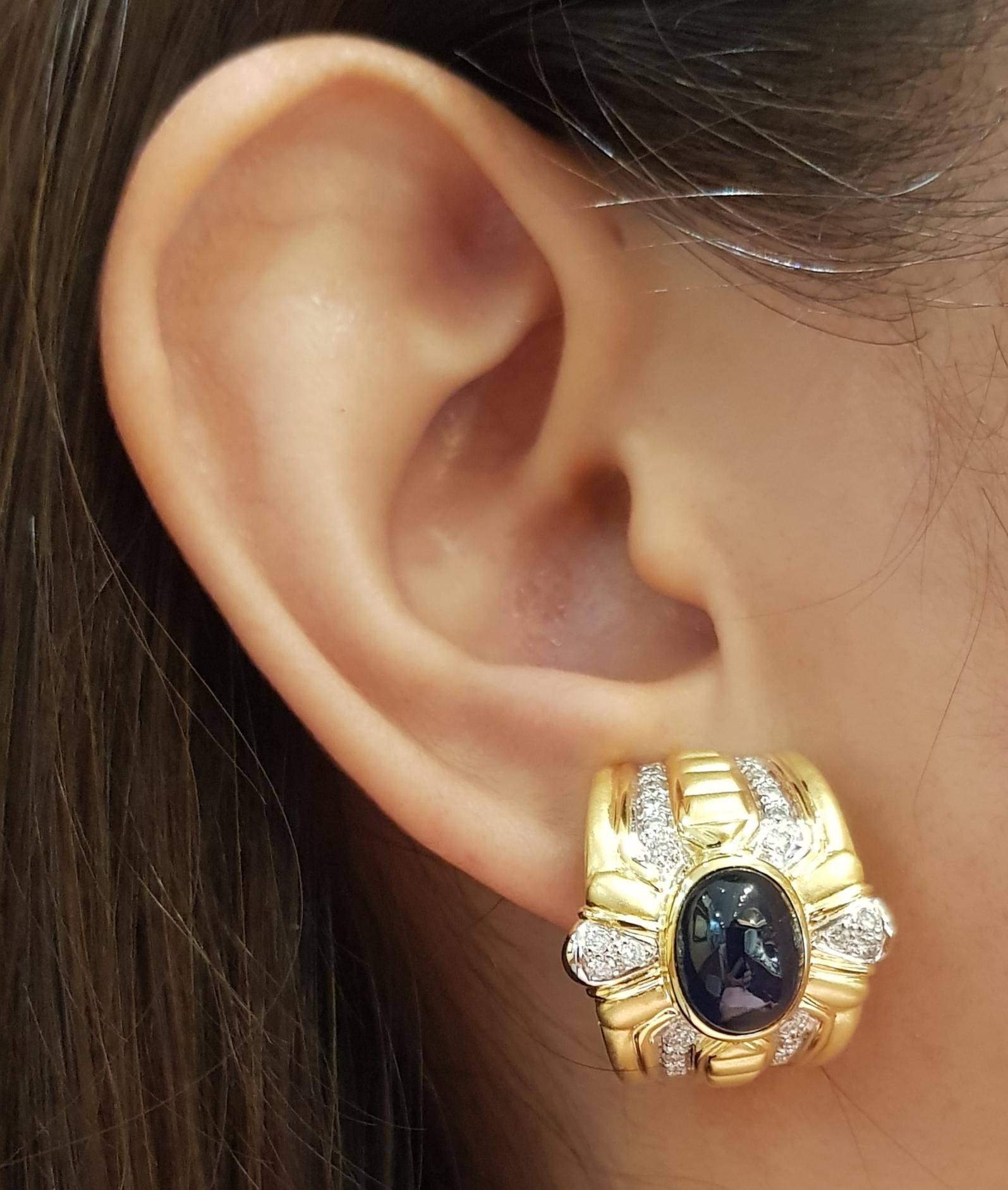 Cabochon Blue Sapphire 9.41 carats with Diamond 0.71 carat Earrings set in 18 Karat Gold Settings

Width:  2.0 cm 
Length: 2.2 cm
Total Weight: 29.19  grams

