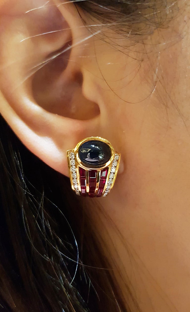 Cabochon Blue sapphire 6.05 carats with Ruby 5.24 carats and Diamond 0.69 carat Earrings set in 18 Karat Gold Settings

Width:  1.5 cm 
Length: 2.0 cm
Total Weight: 16.49 grams

