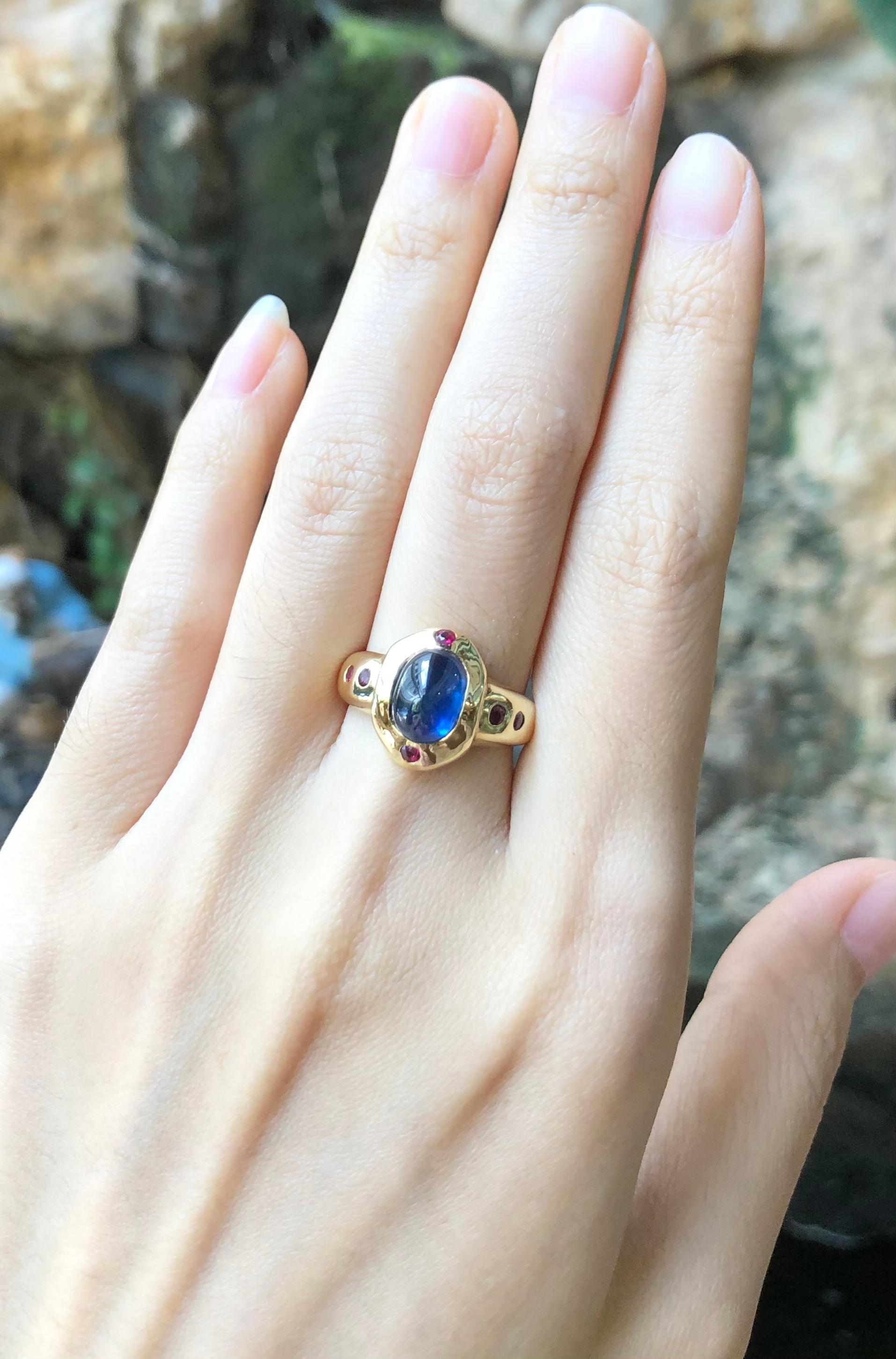 Cabochon Blue Sapphire 2.90 carats with Ruby 0.24 carat Ring set in 18 Karat Gold Settings

Width:  1.0 cm 
Length: 1.4 cm
Ring Size: 53
Total Weight: 6.11 grams

