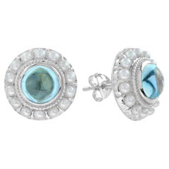 Cabochon Blue Topaz and Pearl Halo Stud Earrings in 9K White Gold