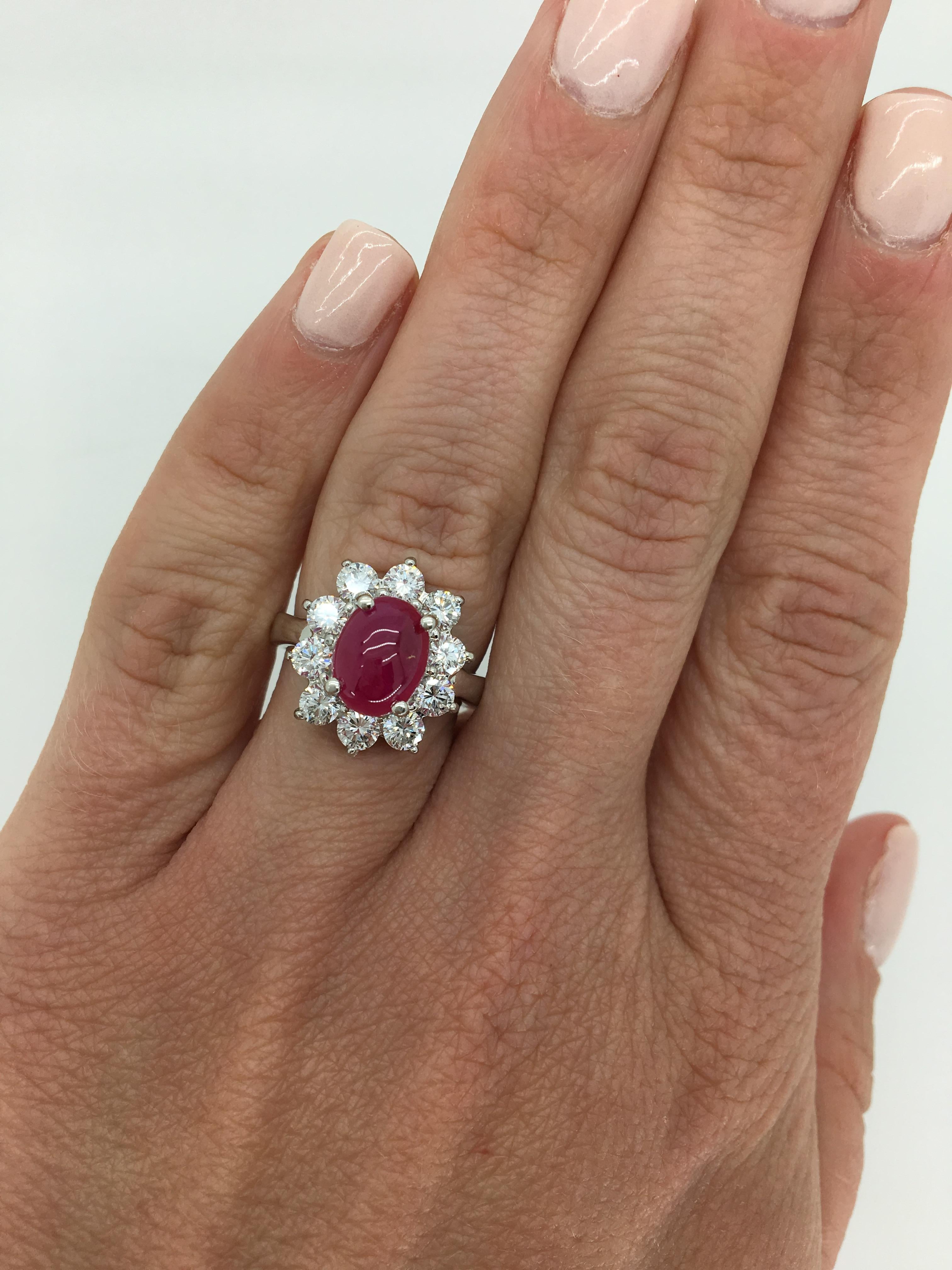 Cabochon cut certified Burma Ruby and Diamond halo ring crafted in platinum.

GIA Certified Report # 6173771491
Gemstone: Ruby & Diamond
Gemstone Carat Weight: Approximately 3.00CT Double Cabochon Cut
Diamond Carat Weight:  Approximately