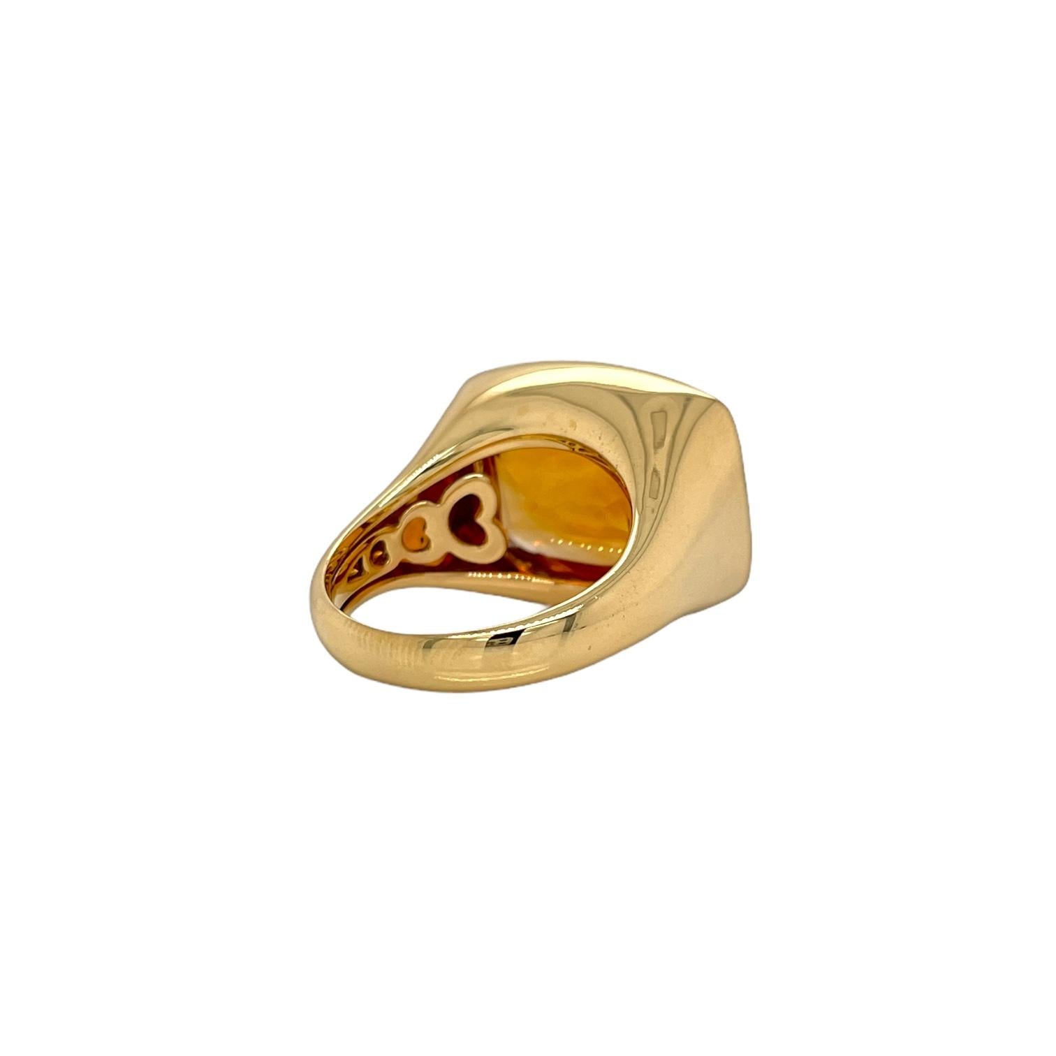 Ring contains one cabochon cut citrine, 19.12cts. Citrine measures approximately 14 x 17mm. Center stone is mounted in a handmade 18K yellow gold bezel setting with a tapered band. Ring is a finger size 7.5 and can be resized to desired measurement.